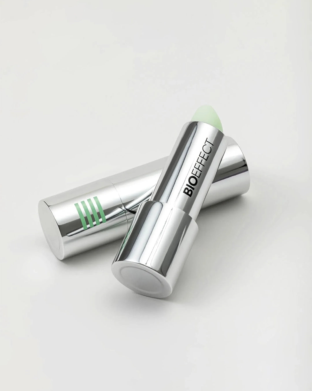 Two BIOEFFECT skincare sticks on a light gray background