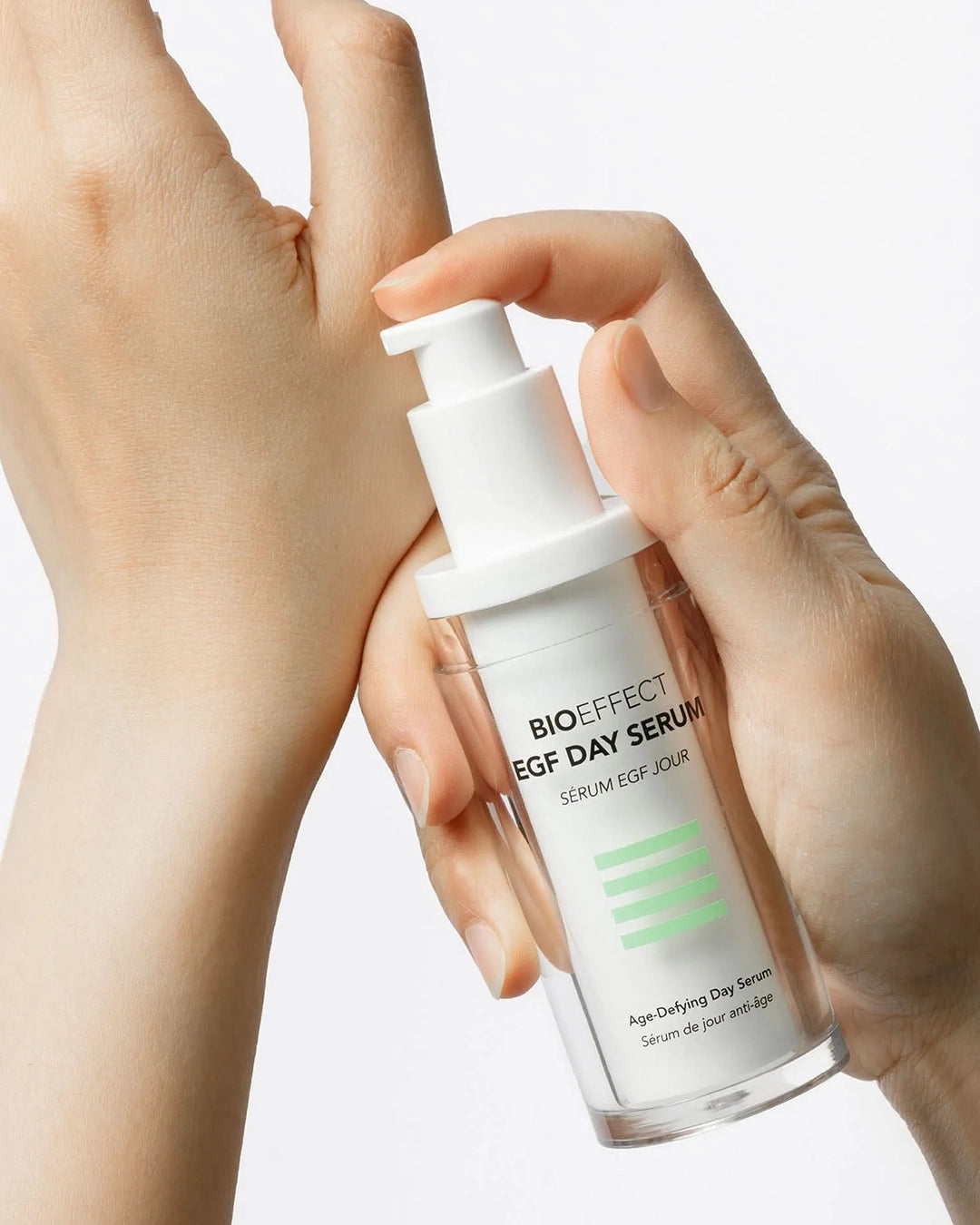 BIOEFFECT EGF Day Serum being held by a hand on a light background