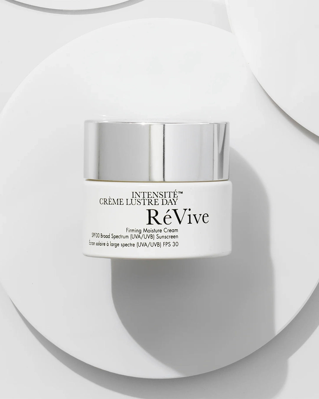 ReVive Intensive Crème Lustre Day cream jar on a white background