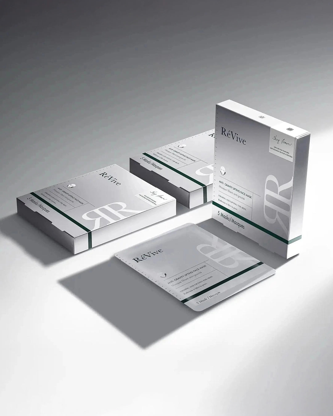 ReVive skincare product packaging on a gray background