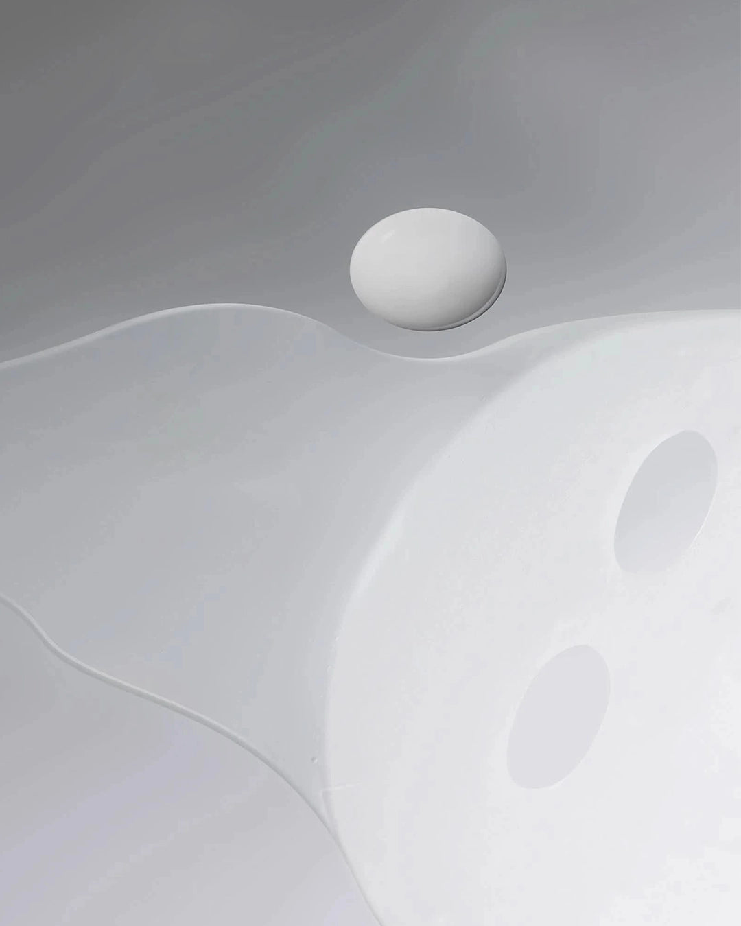 Abstract white mask with a smooth surface on a gray background