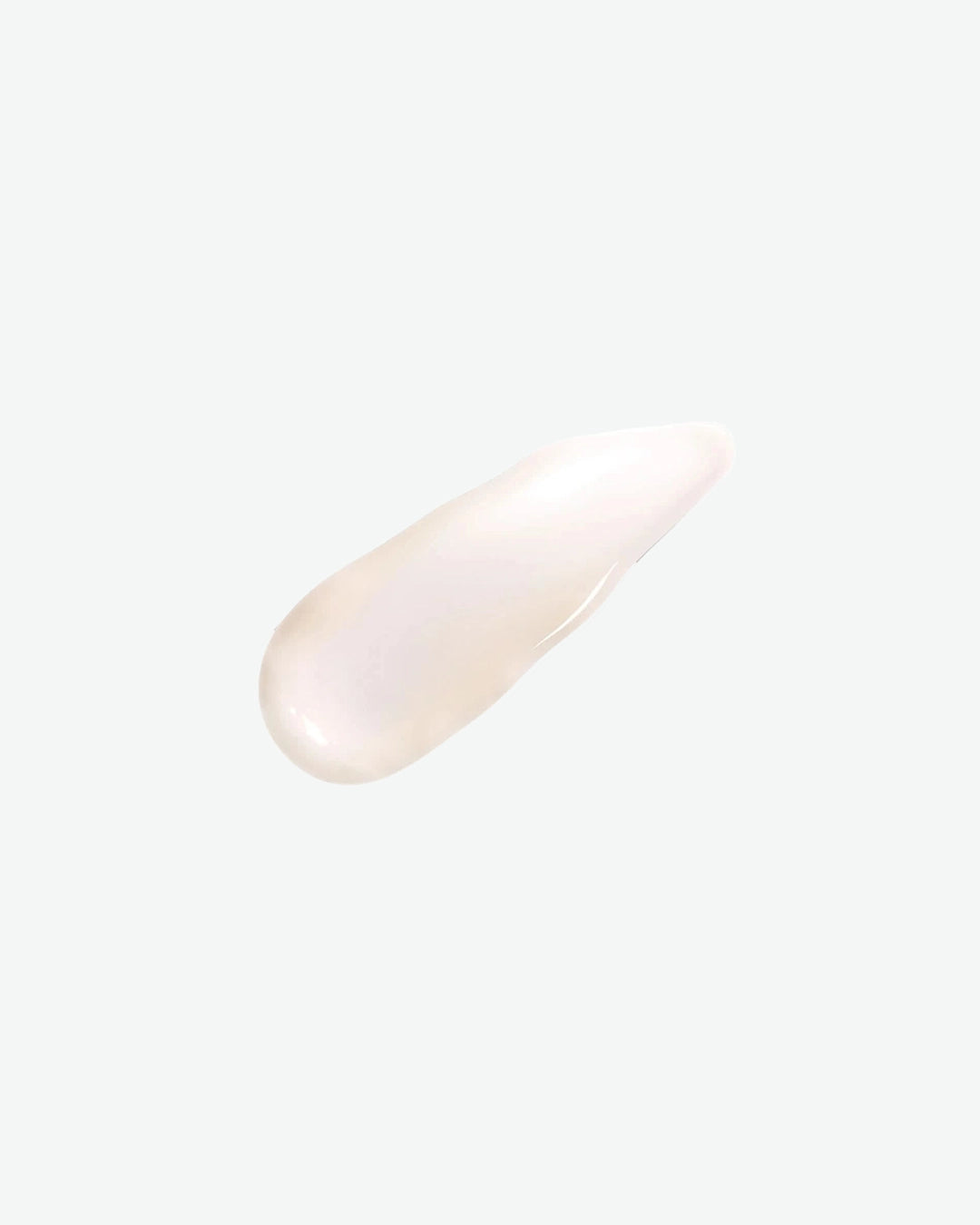 White cream swatch on a light pink background