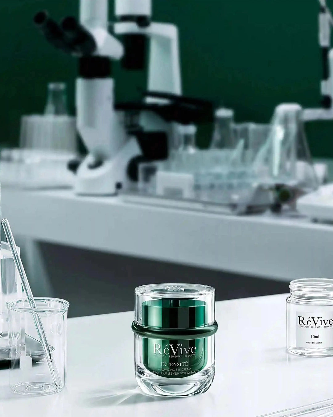 ReVive skincare product on a lab bench with scientific equipment in the background