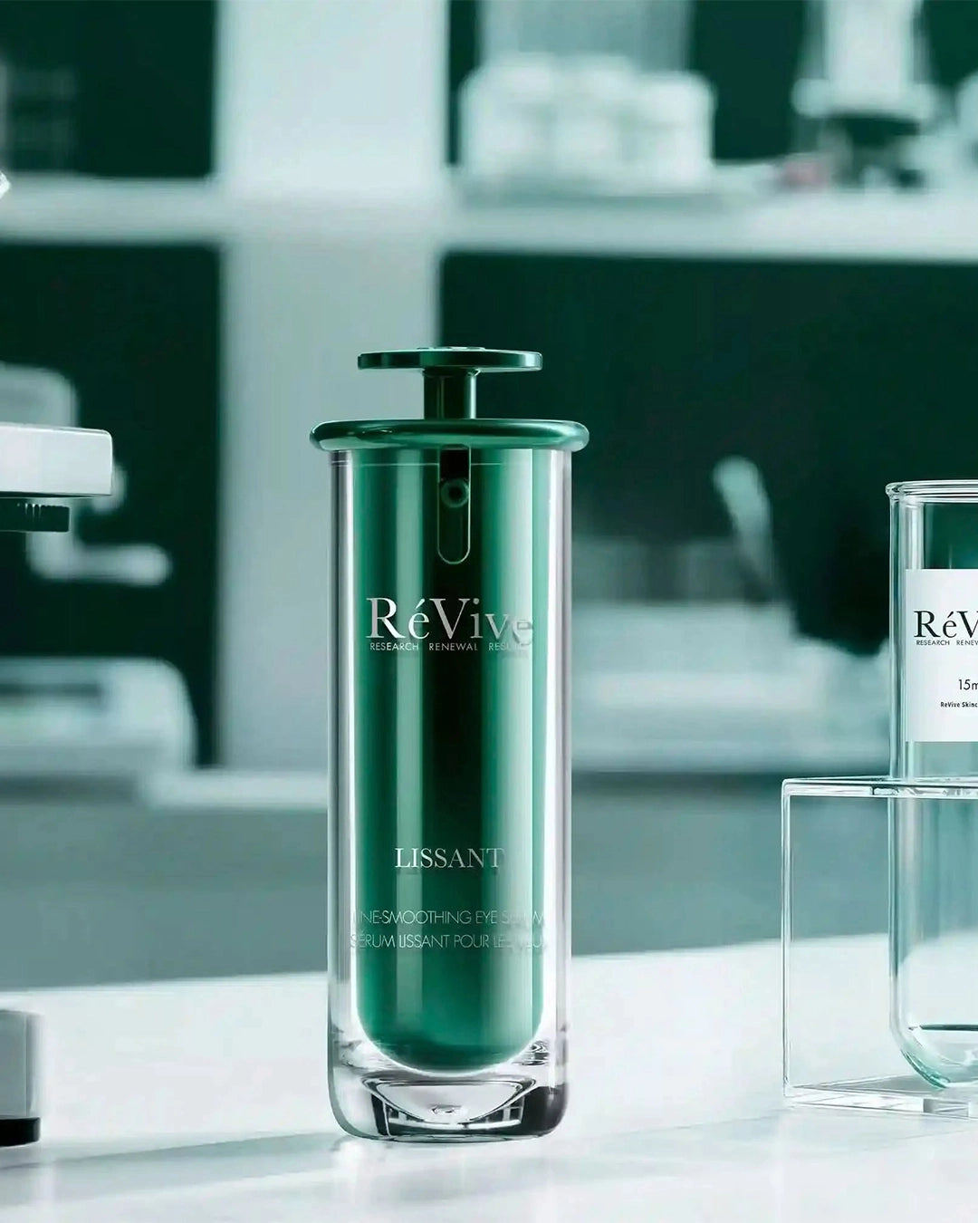 ReVive skincare bottle on a blurred background