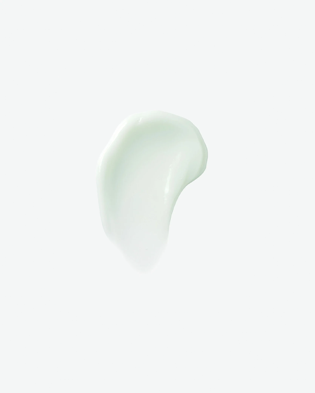 A top-down product texture shot featuring a smooth, curved swipe of light seafoam-green gel cleanser isolated against a clean, minimalist white background.