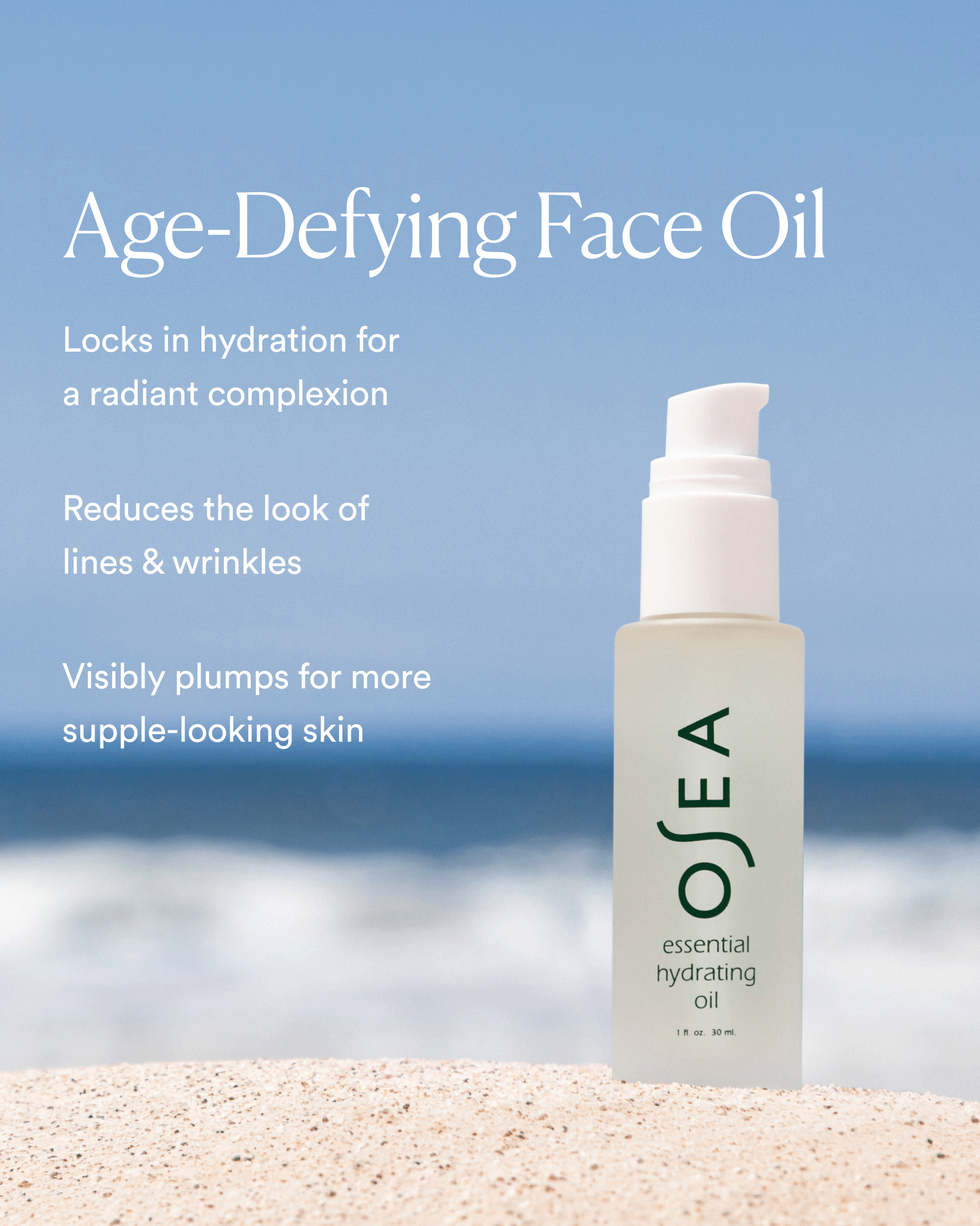A bottle of OSEA Essential Hydrating Oil sitting on a sandy beach with an ocean backdrop and text outlining its age-defying benefits.