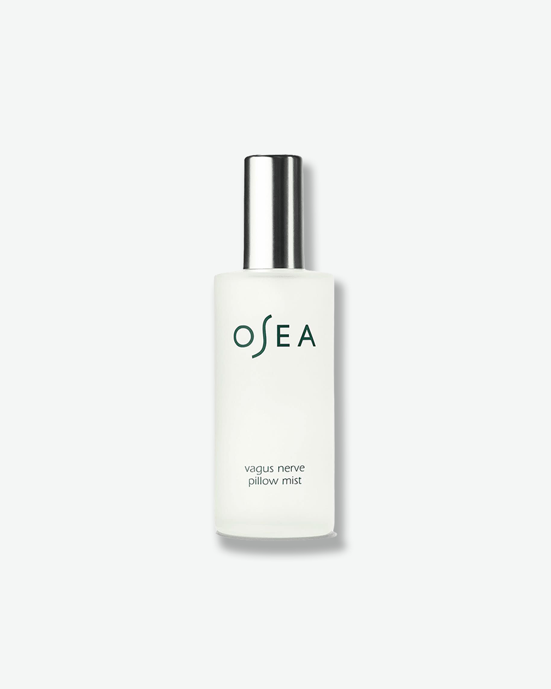 A vertical product shot of OSEA Vagus Nerve Pillow Mist. The mist is contained within a cylindrical frosted glass bottle and is topped with a sleek, reflective metallic silver spray cap. The dark green OSEA brand logo and the product name are printed cleanly on the front against a plain white background.