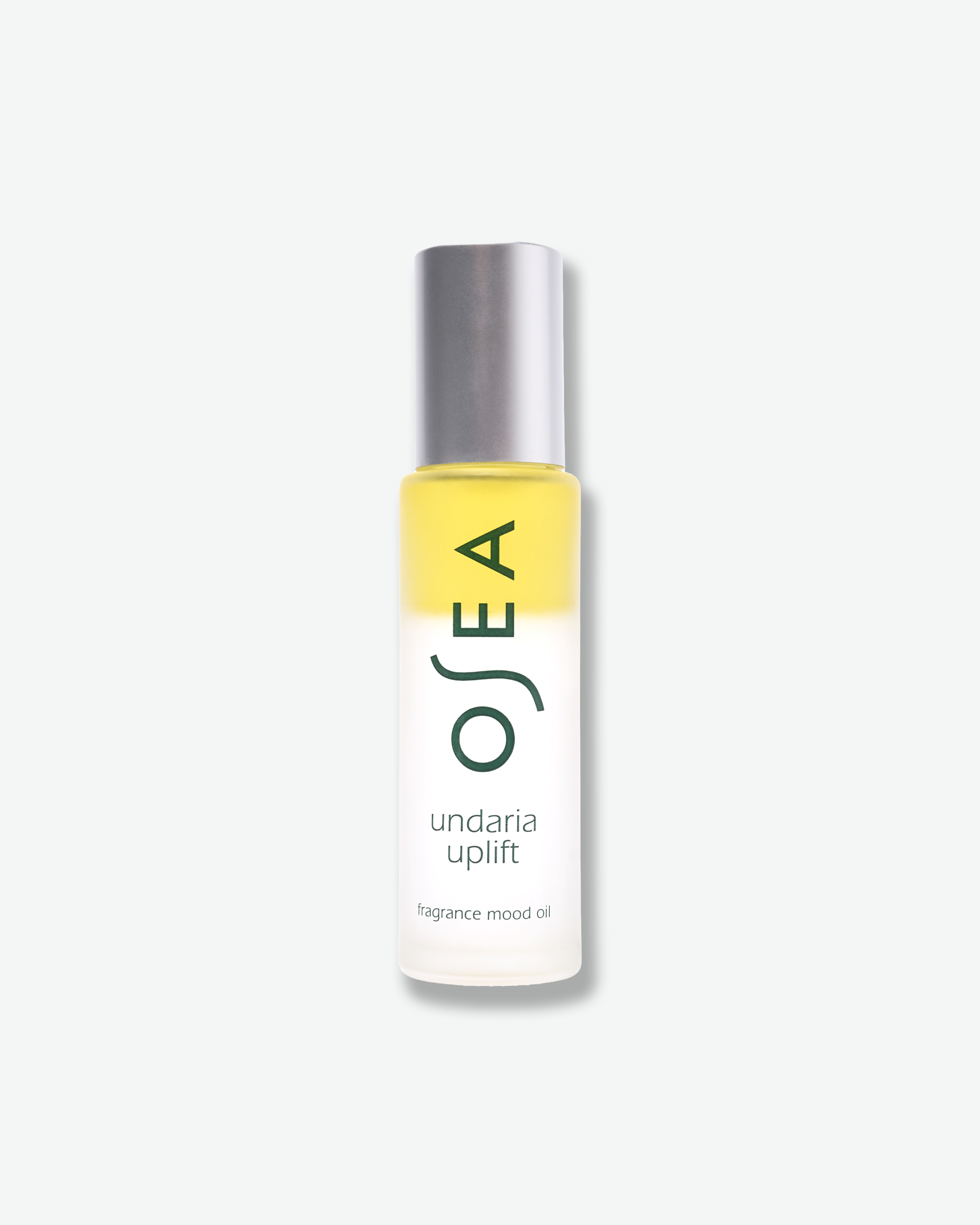 A bottle of OSEA undaria uplift fragrance mood oil with a silver cap and a white-to-clear gradient bottle showing yellow oil inside, set against a light gray background.