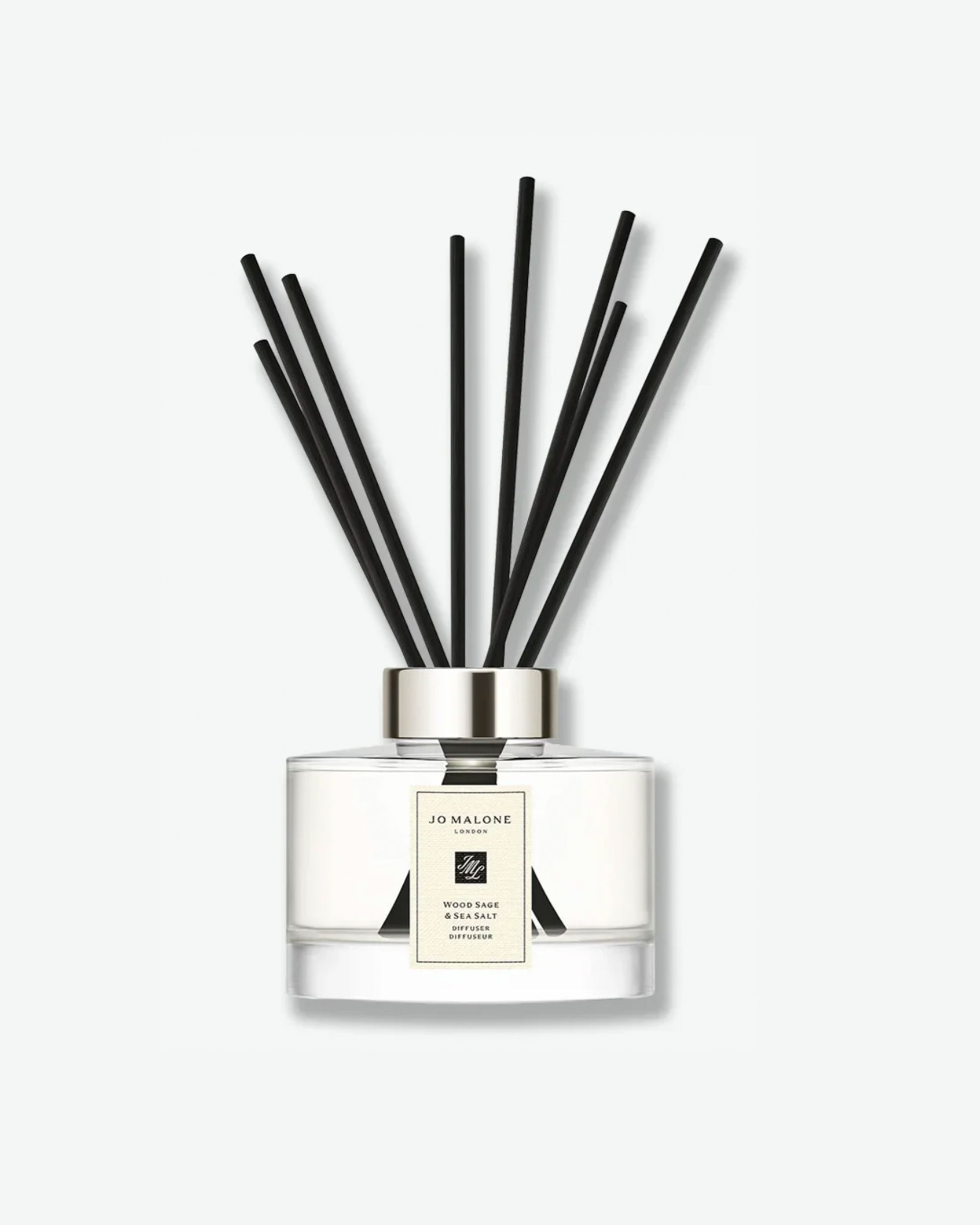 Jo Malone Wood Sage & Sea Salt glass jar diffuser with black reeds on a white background
