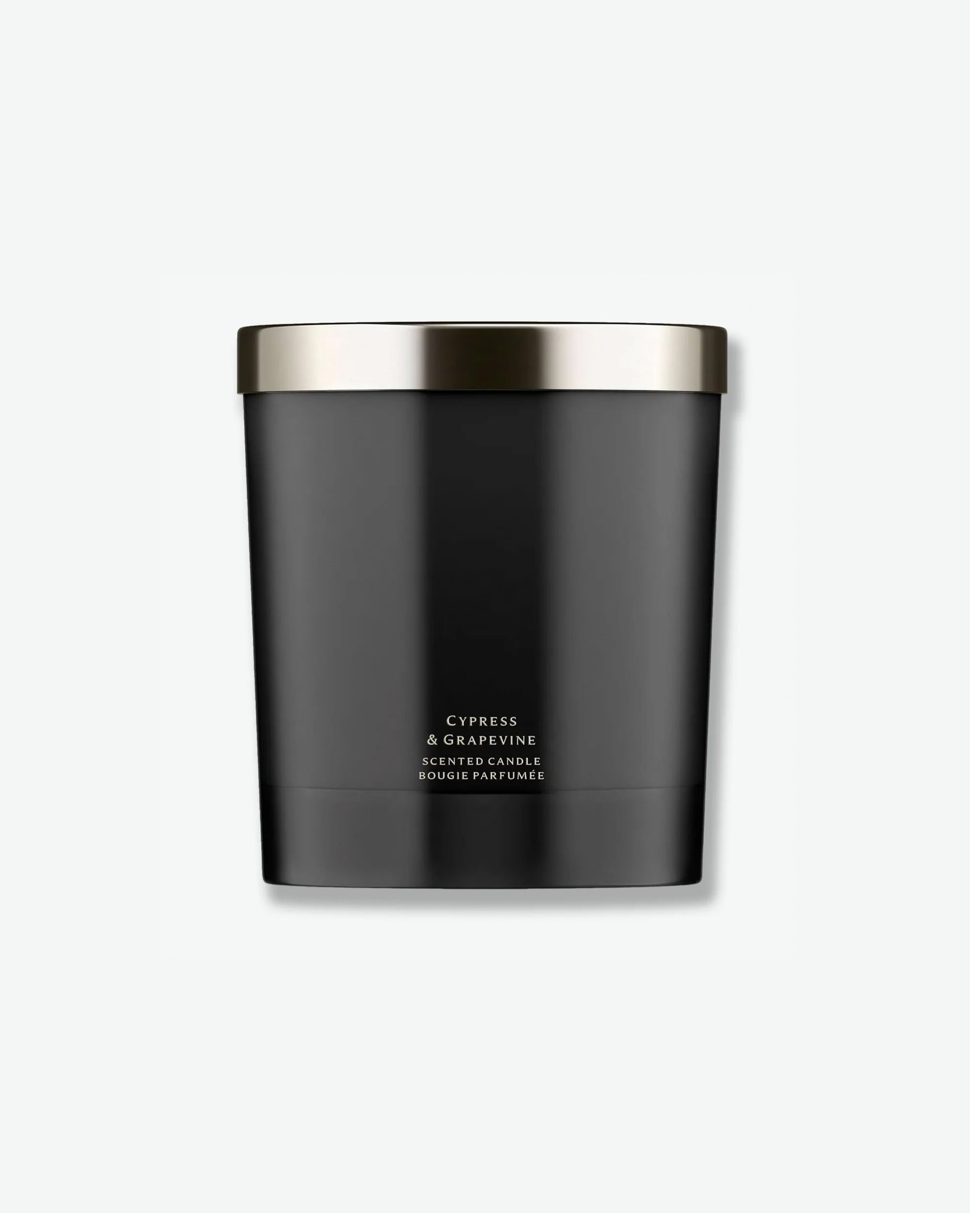 Front view of a Jo Malone Cypress & Grapevine scented candle. The candle is housed in a sleek, matte black cylindrical vessel topped with a polished, metallic silver lid. Near the base, minimal white text reads "Cypress & Grapevine Scented Candle / Bougie Parfumée".