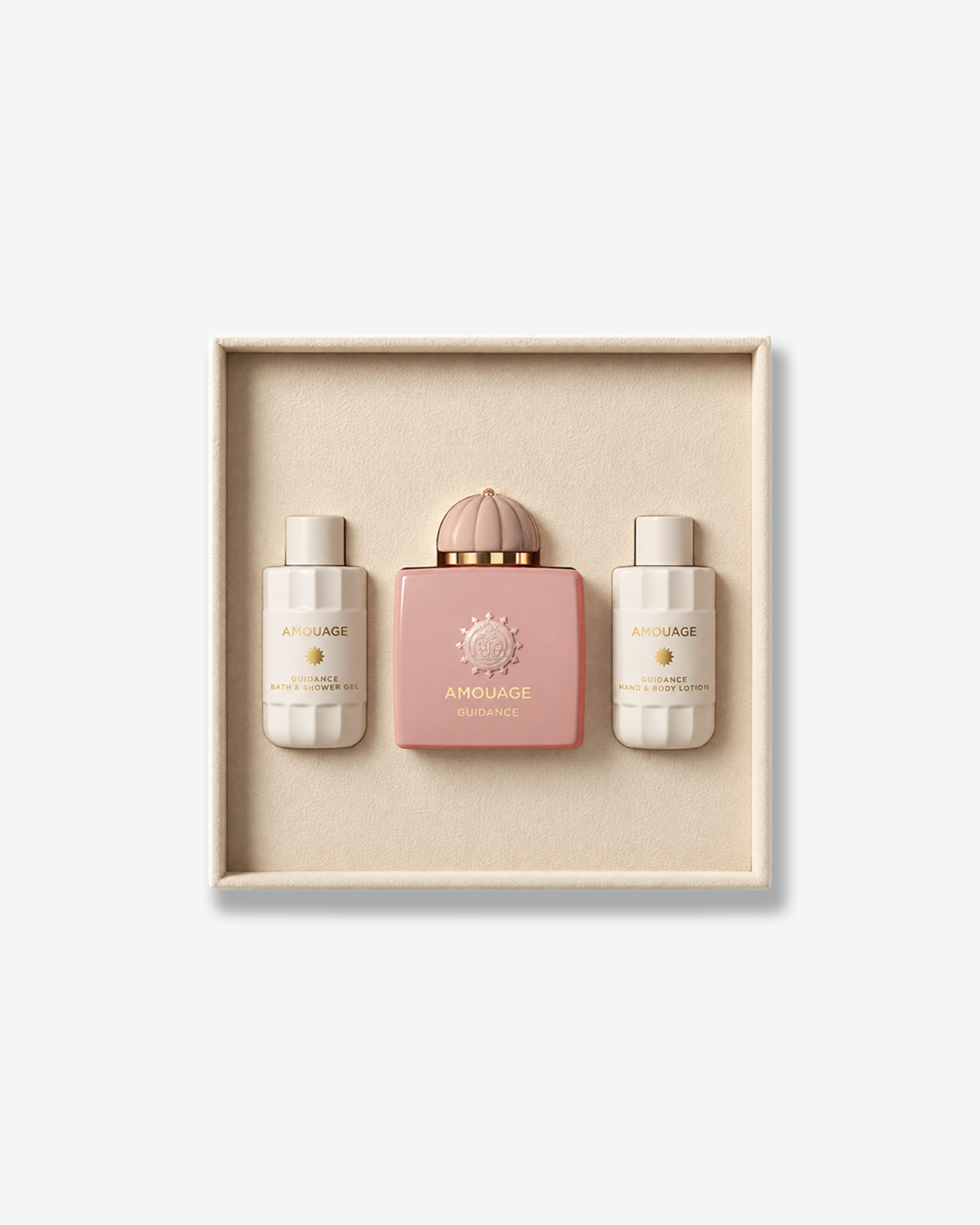 Amouage Guidance Gift Set featuring Guidance Eau de Parfum, Bath & Shower Gel, and Hand & Body Lotion in a cream presentation box.