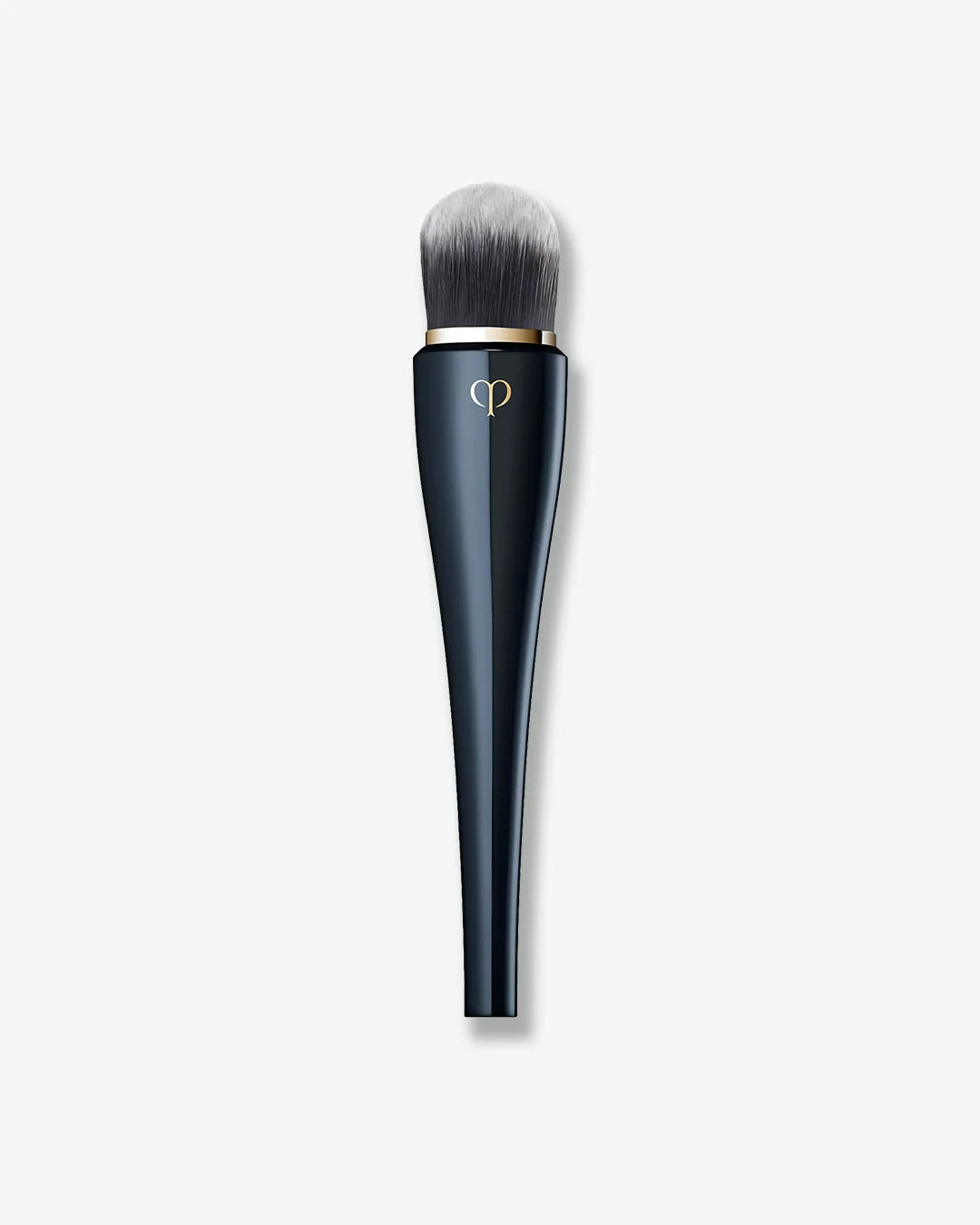 Makeup brush with black handle and gold accent on a white background
