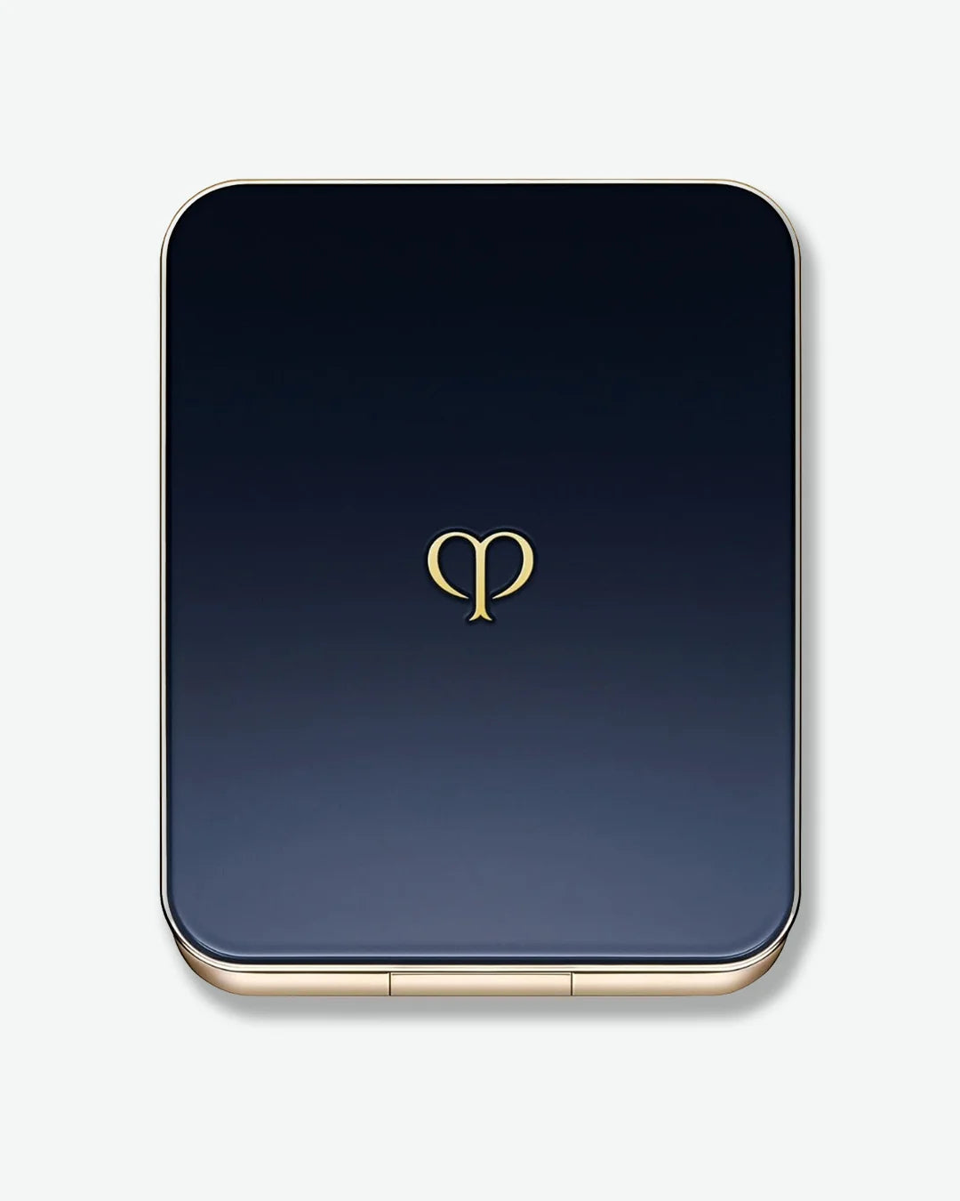 Makeup compact with a gold logo on a gradient blue background