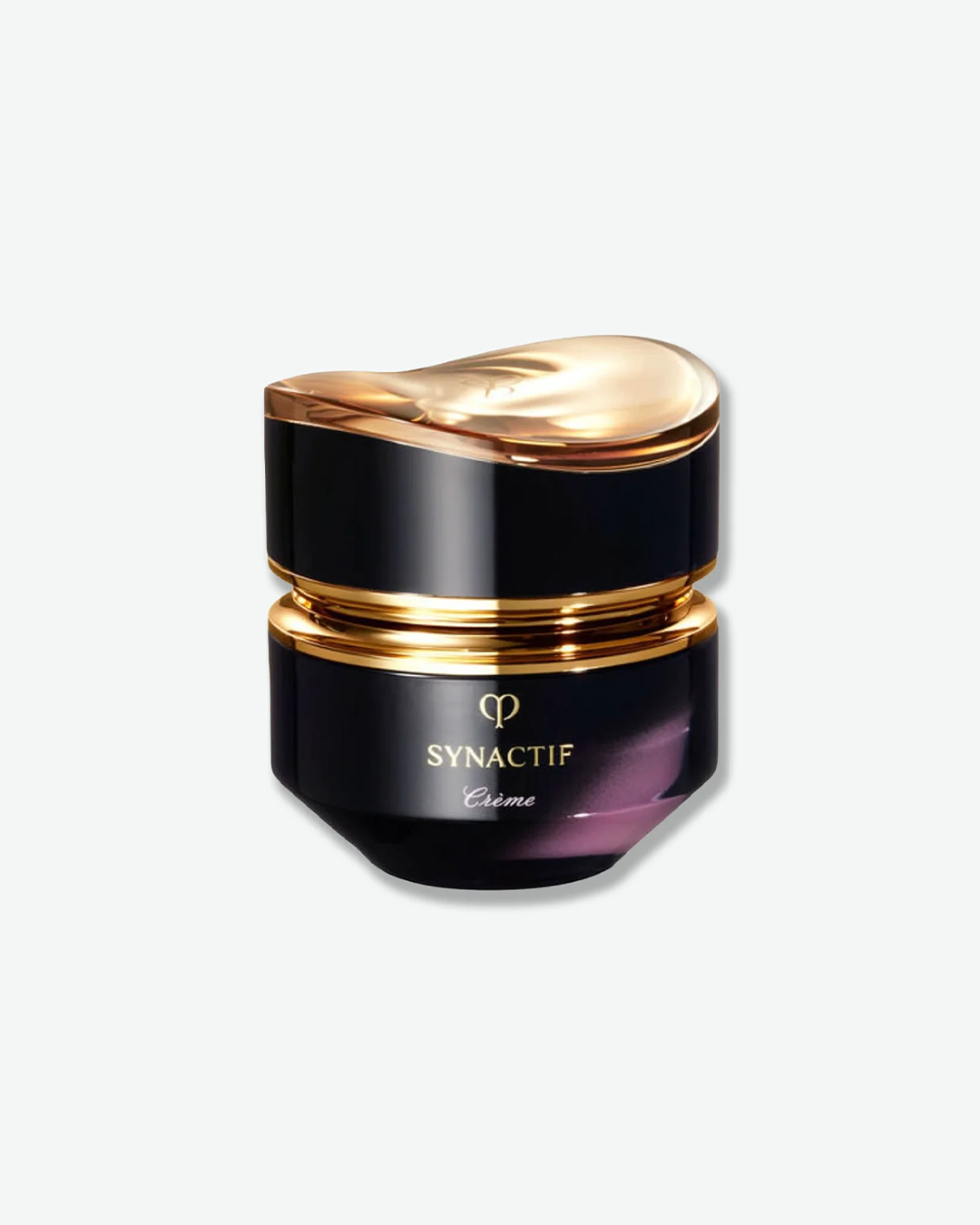 Clé de Peau Beauté Synactif Crème in a luxurious, multi-faceted black and deep purple ombré jar featuring an asymmetrical gold lid, isolated against a light grey background.