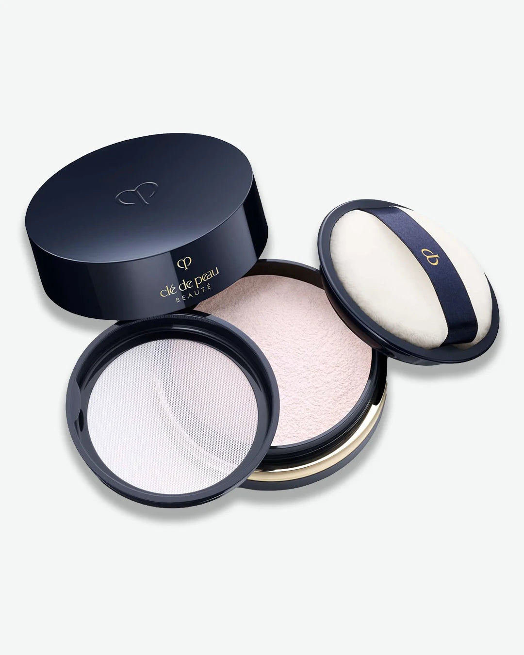 Makeup compact with two shades of powder on a white background