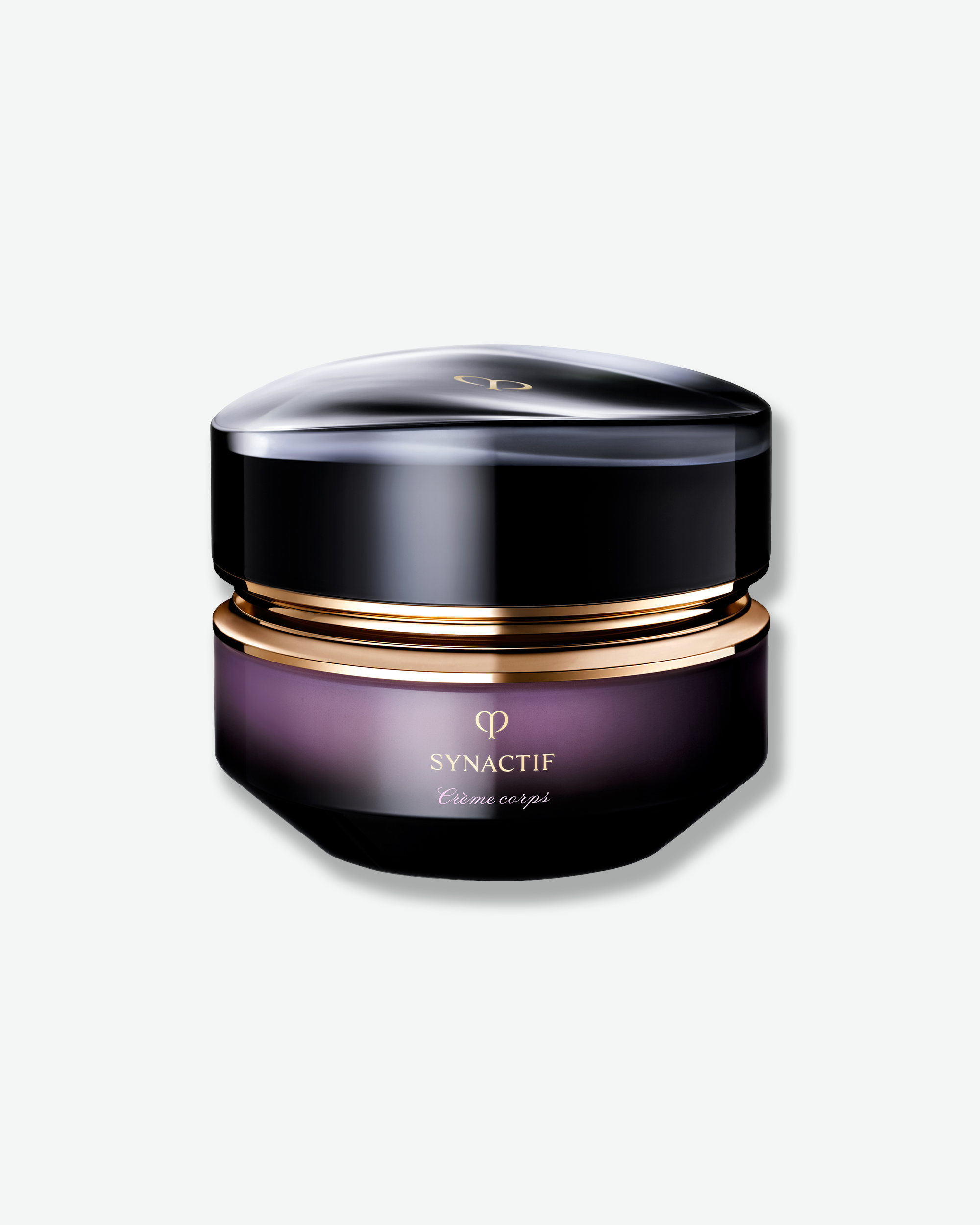 A premium cosmetic jar with a glossy black lid and a deep purple body, featuring a metallic gold band and gold lettering that reads 'SYNACTIF' and 'Crème exélé', set against a clean off-white background.