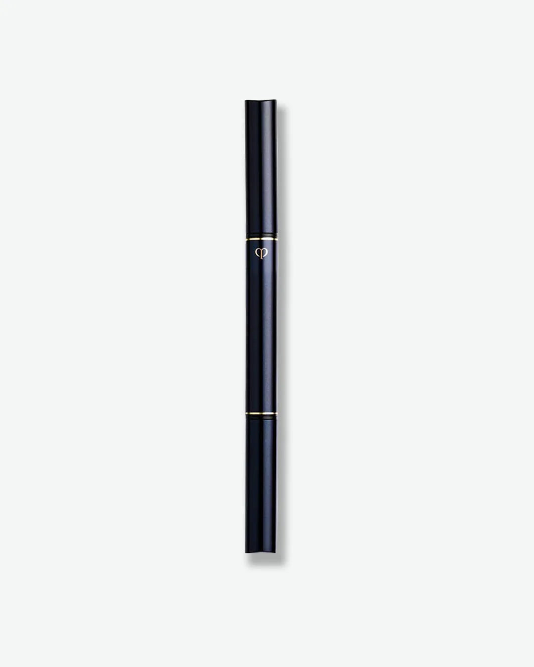 A sleek dual-ended makeup pen with a deep navy blue barrel and gold accent rings. The slim, cylindrical design features the Clé de Peau Beauté logo at the center and is displayed vertically against a light gray background.