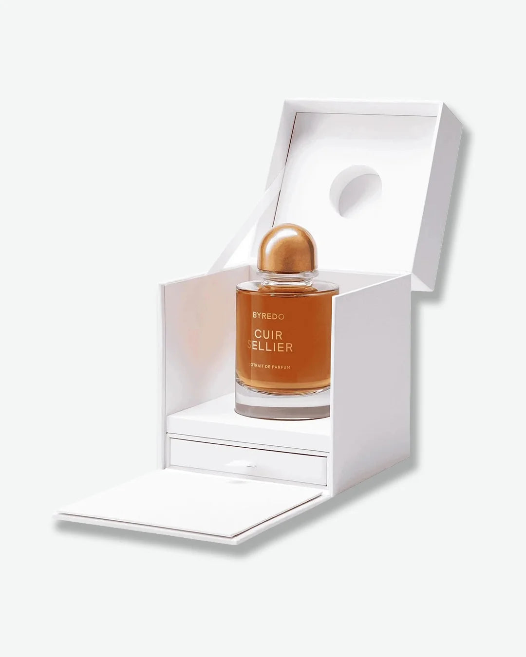 Perfume bottle with bronze color cap in a white box on a white background