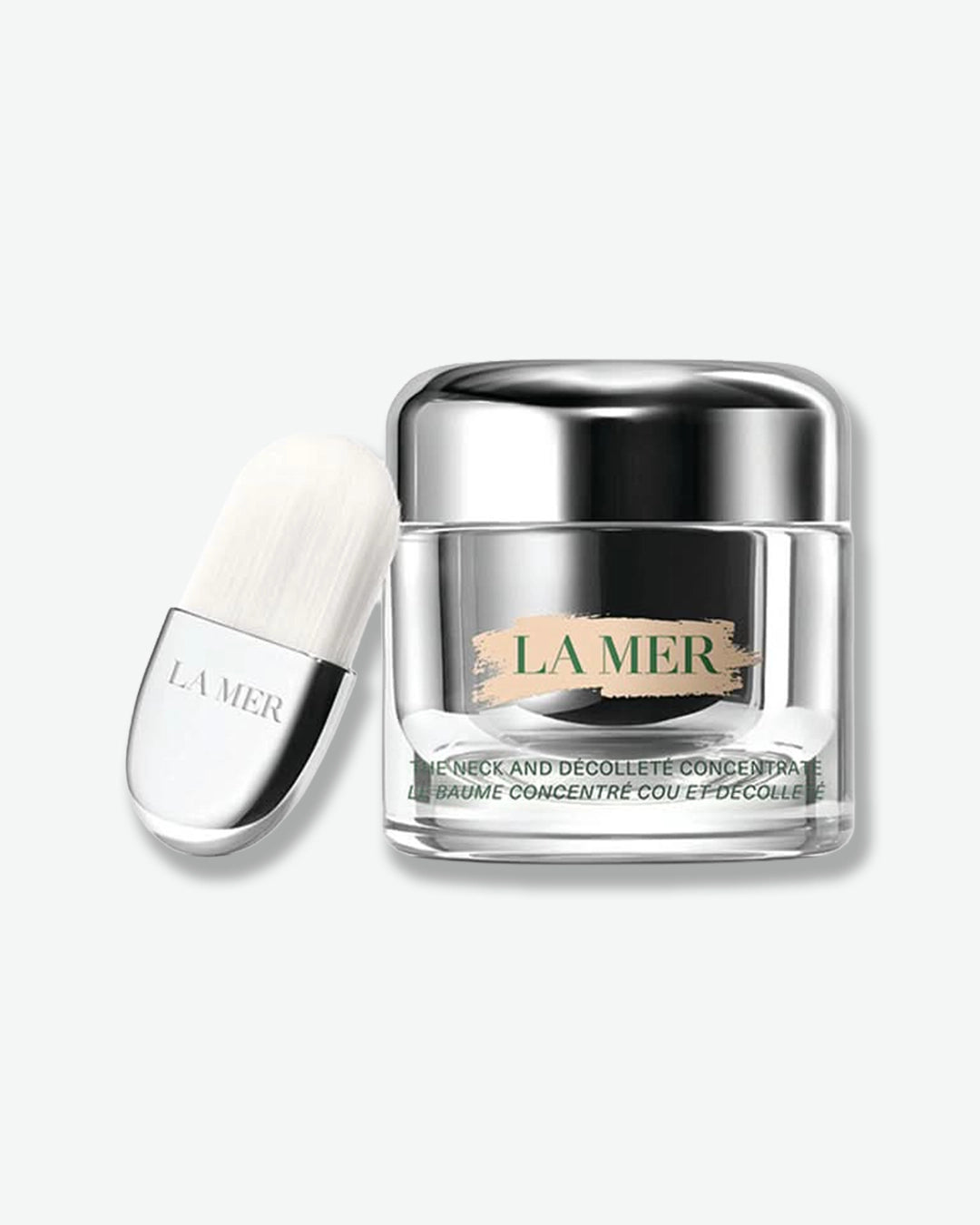 La Mer skincare product with silver cap and clear container on a white background