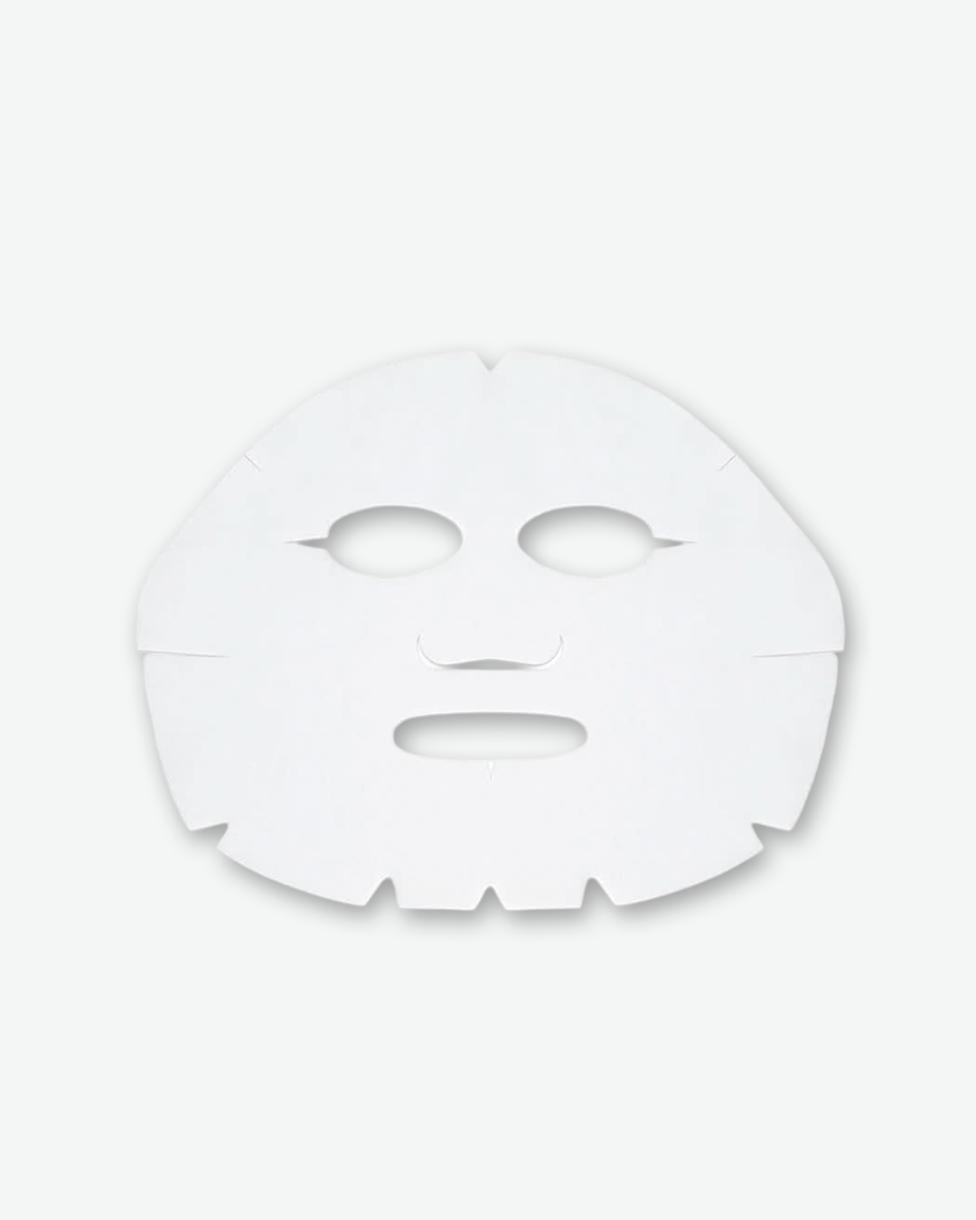 A single, unfolded white cloth sheet mask designed for facial skincare. The mask is centered against a solid light gray background with a soft drop shadow behind it, showing clean cutouts for the eyes, a flap for the nose, an opening for the mouth, and small slits along the outer edges to help it contour to the face.