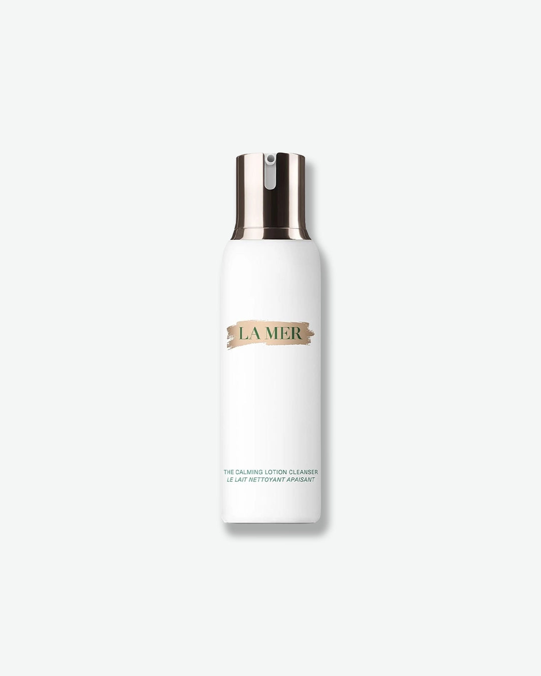 Product image of The Calming Lotion Cleanser by La Mer displayed against a light gray background. The cleanser is housed in a sleek white bottle with a metallic silver pump and La Mer’s signature logo on the front. The minimalist packaging highlights the gentle facial cleanser designed to cleanse and comfort the skin.