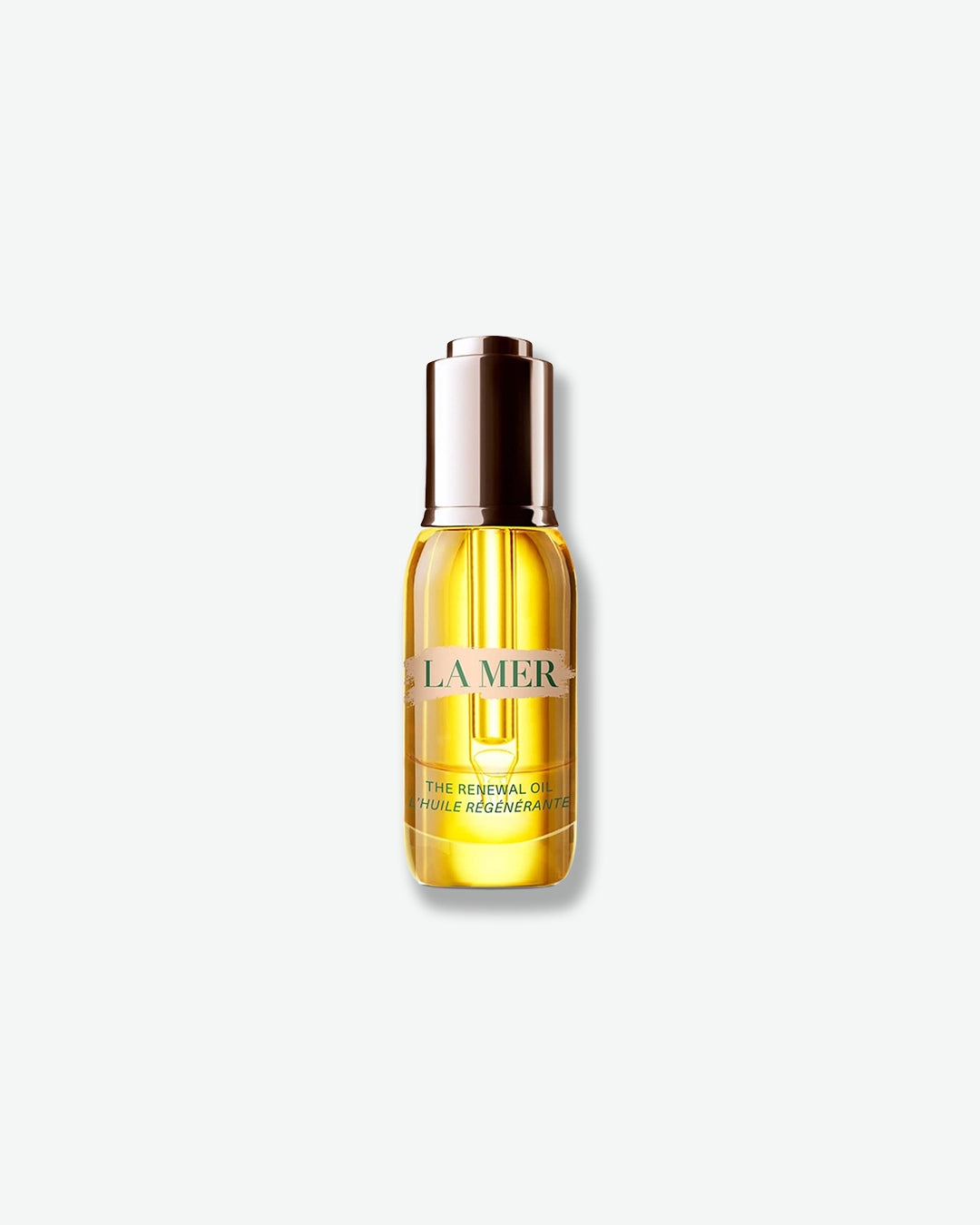 A clear glass bottle filled with a bright golden skincare oil, featuring a metallic gold and silver dropper cap. The label reads "LA MER" in green text on a brushed background, with "THE RENEWAL OIL / L'HUILE RÉGÉNÉRANTE" printed underneath. The bottle is centered against a solid, light gray backdrop.