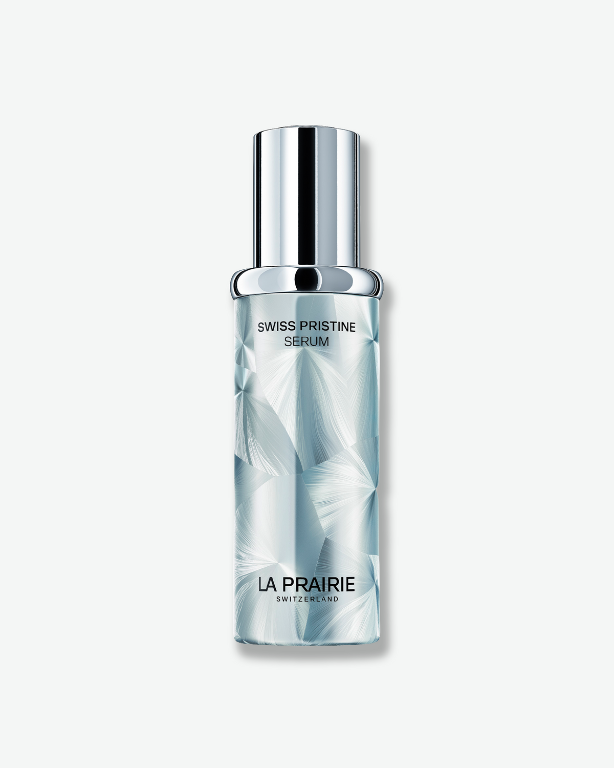 La Prairie Swiss Pristine Serum in an icy blue, faceted bottle with a reflective silver cap on a clean white background.
