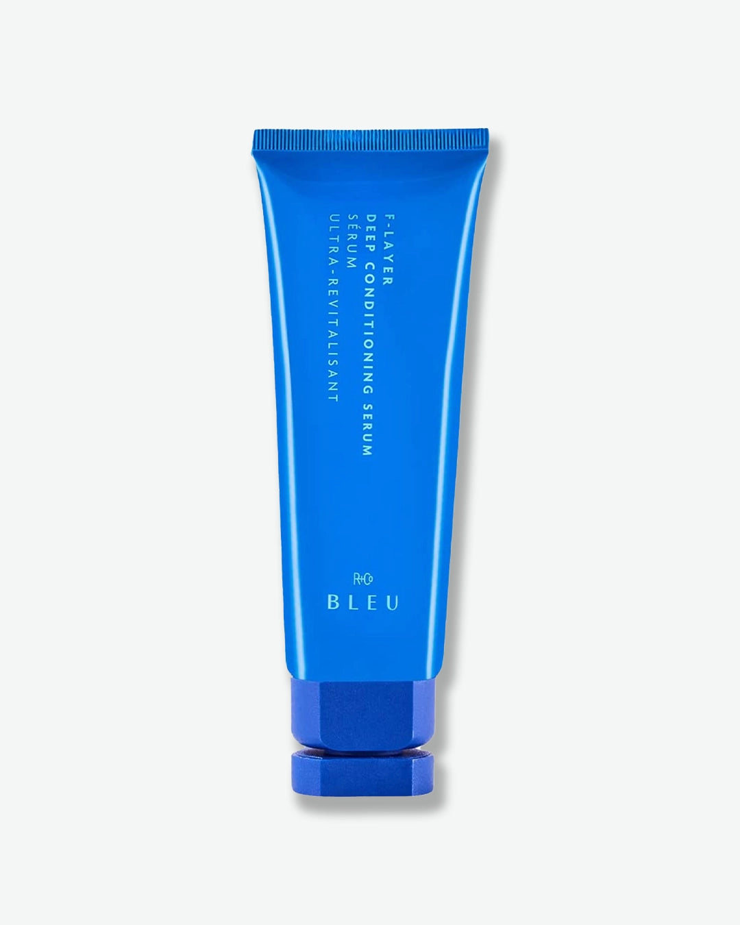 Blue tube of serum with 'BLEU' branding on a white background