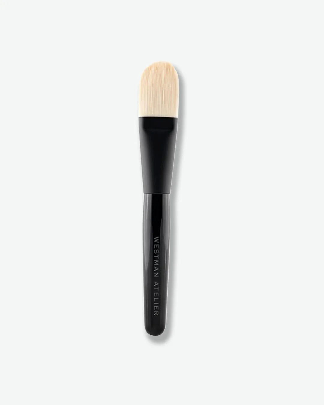 Makeup brush with black handle and flat bristle on a white background
