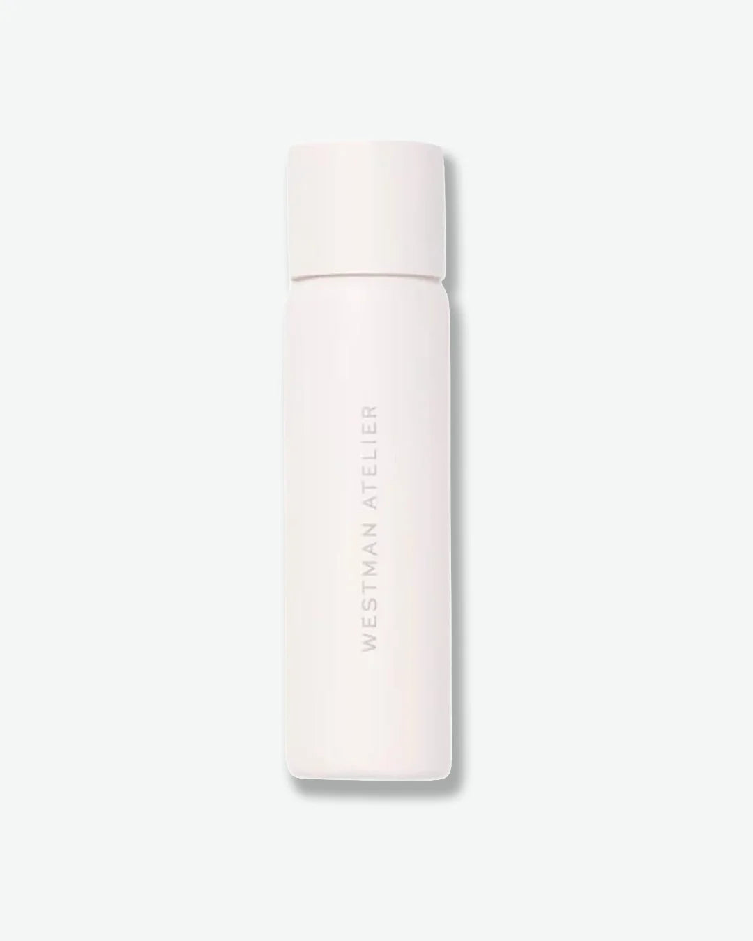 White cylindrical container with 'Westman Atelier' branding on a light gray background
