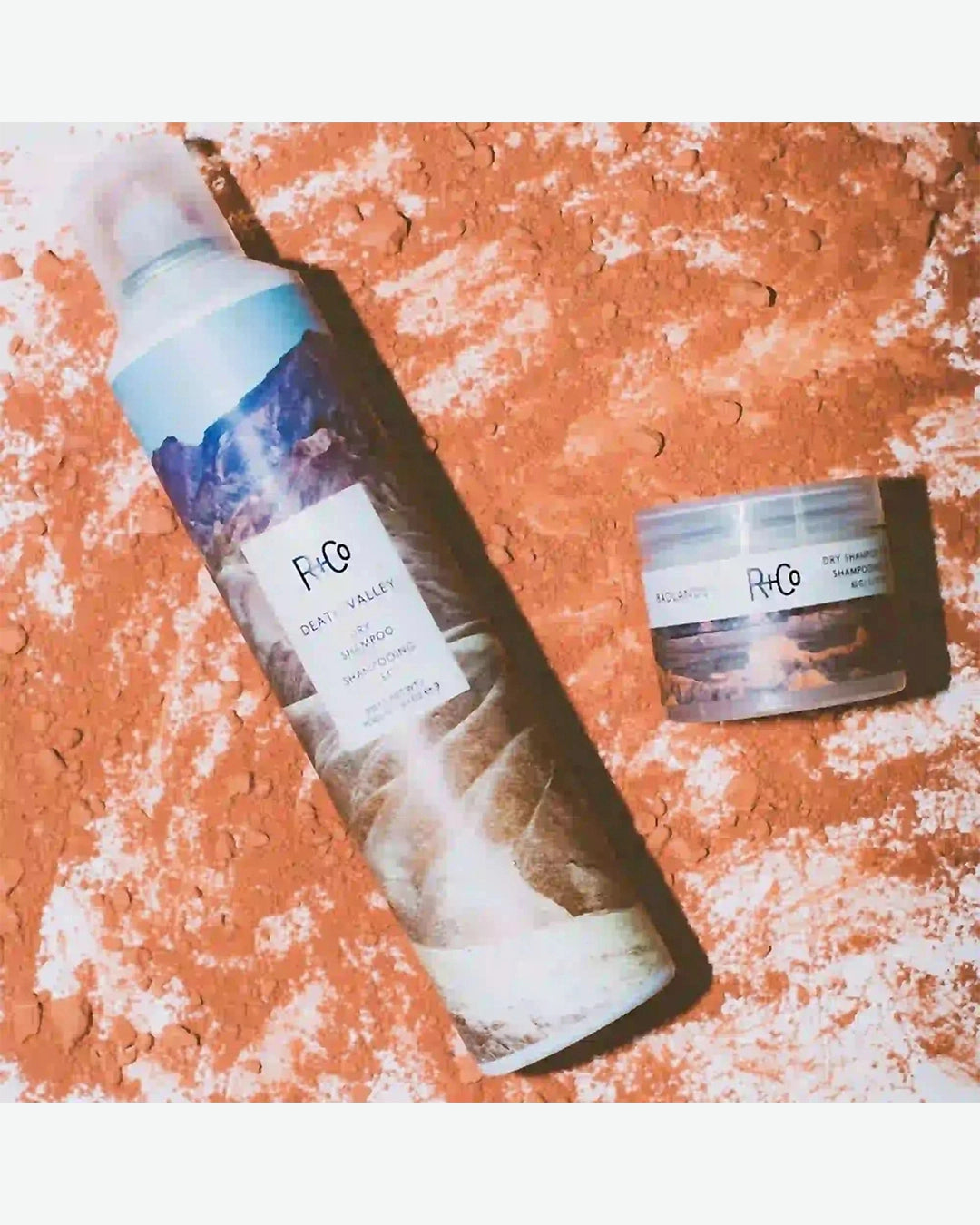 Two Death Valley skincare products on a textured orange surface