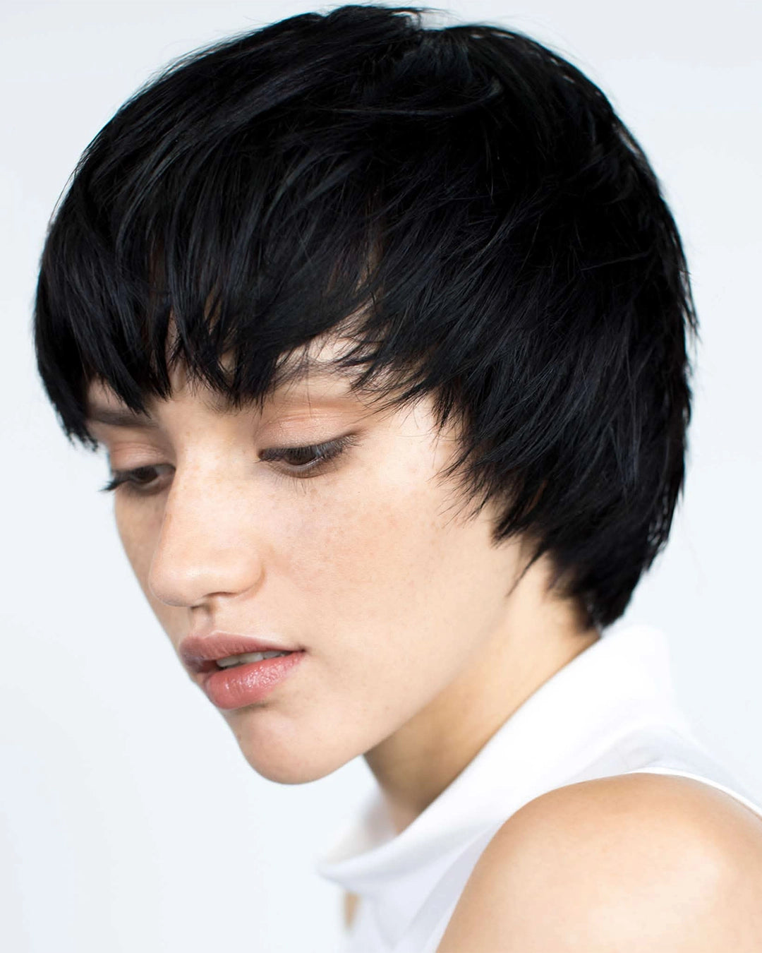 Woman with a stylish black haircut on a white background