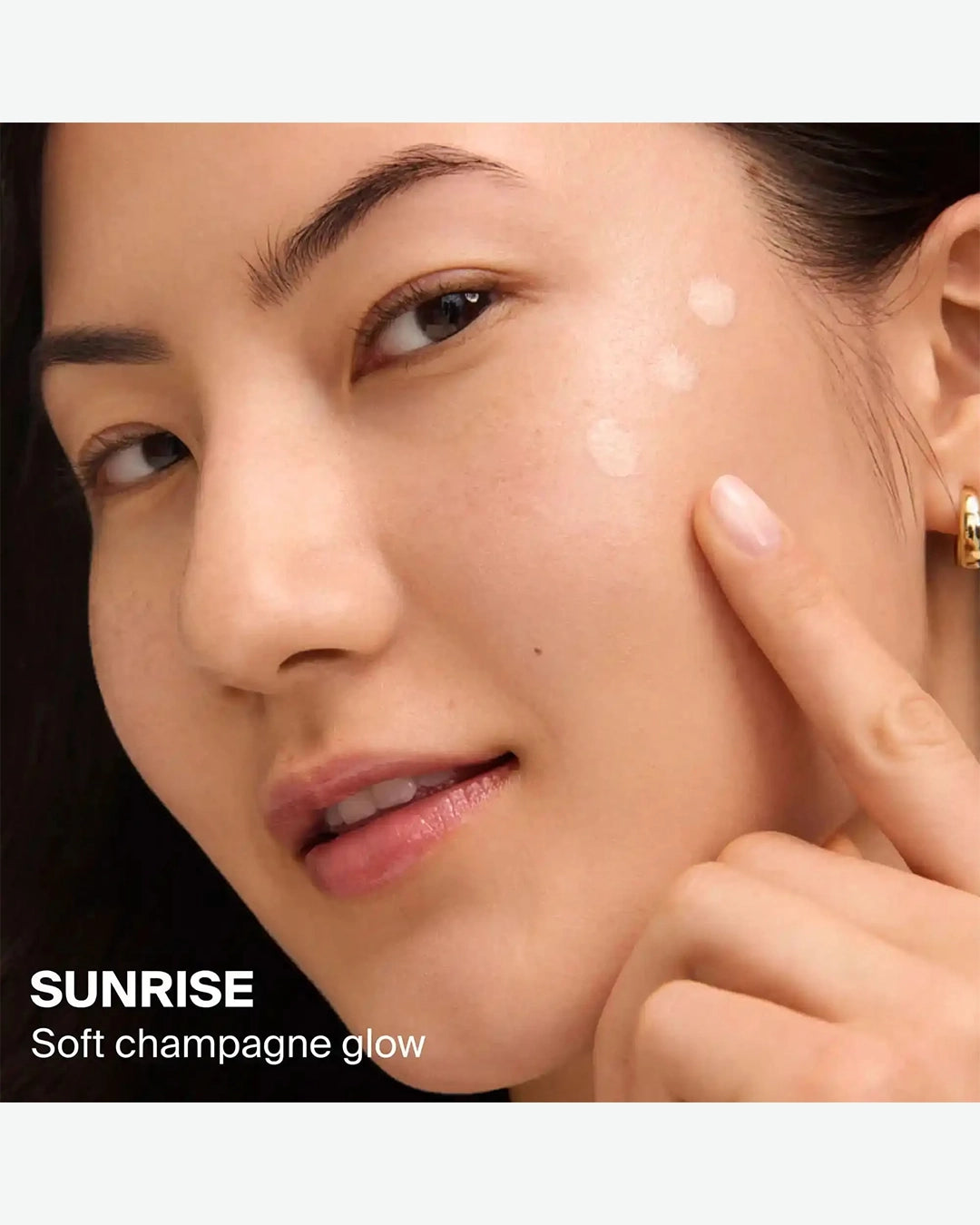 Close-up of a person's face with 'Sunrise' soft champagne glow text