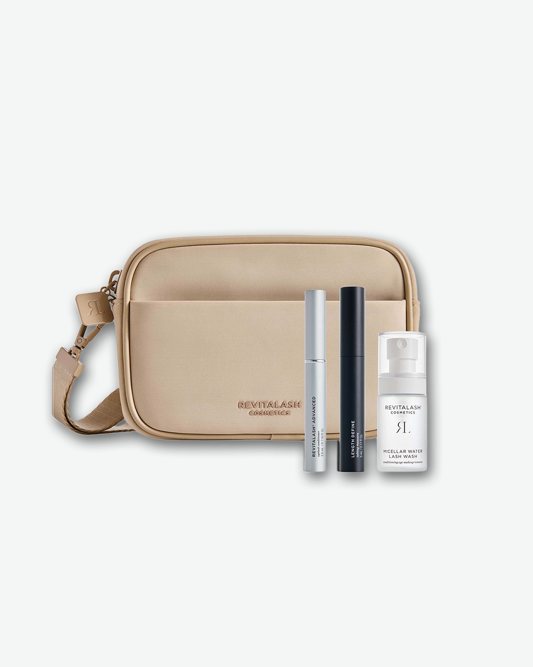 Beige crossbody bag with RevitaLash products on a white background
