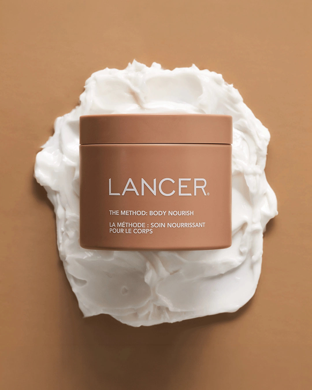 Lancer skincare product with whipped cream on a brown background