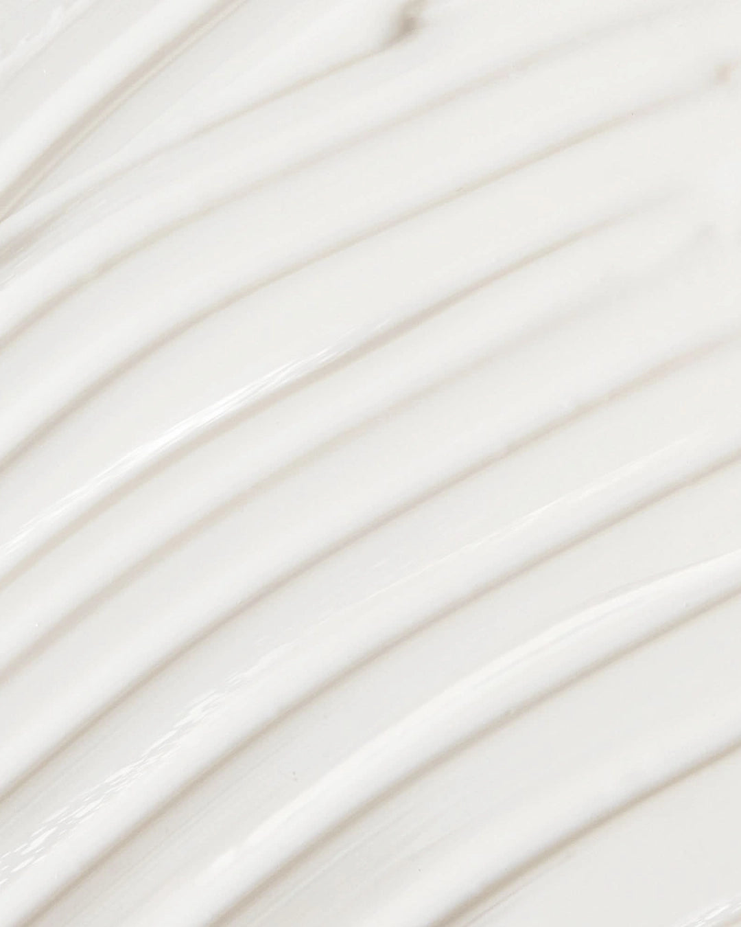 Close-up of white cream with horizontal lines