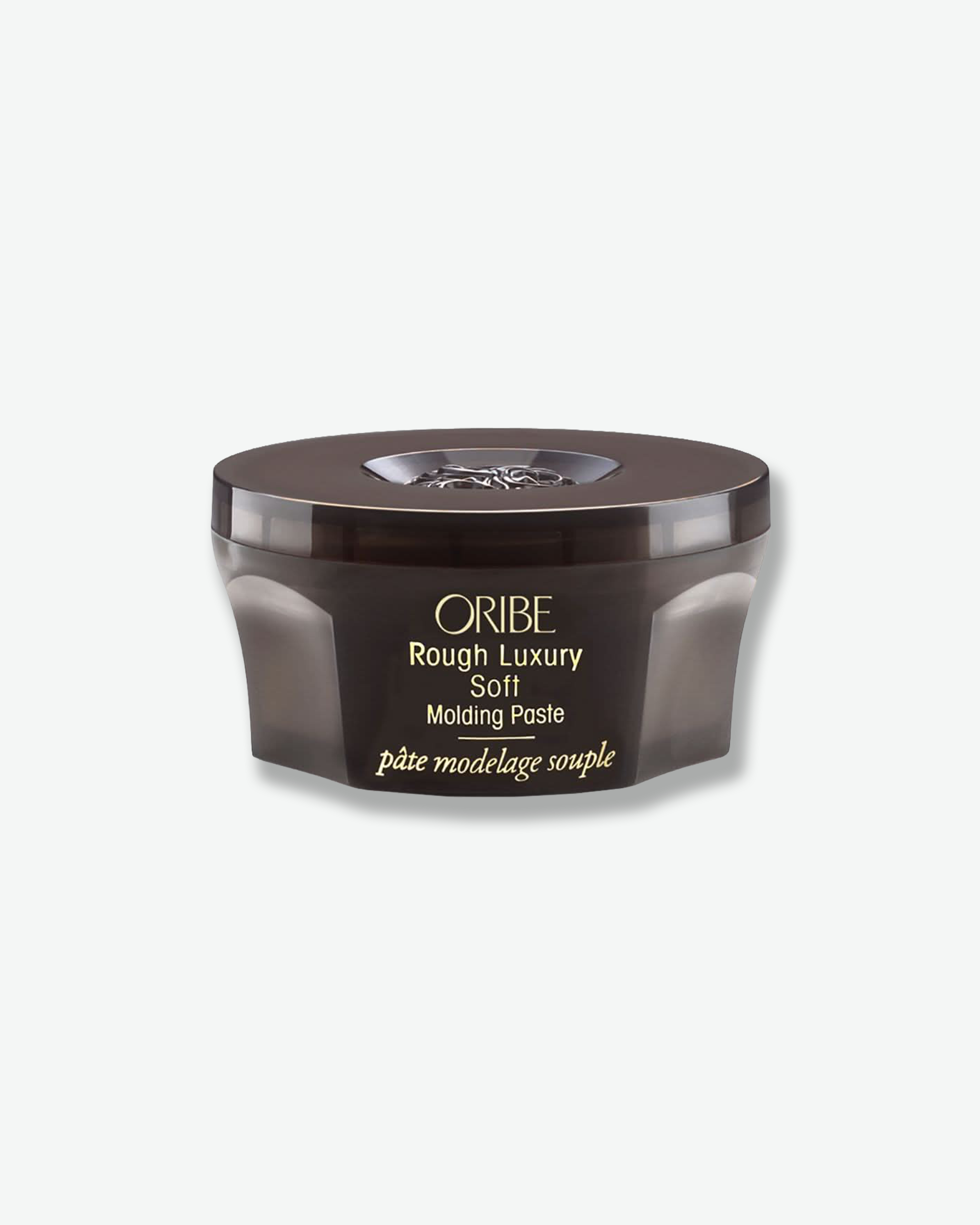 Oribe Rough Luxury Soft Molding Paste jar on a white background