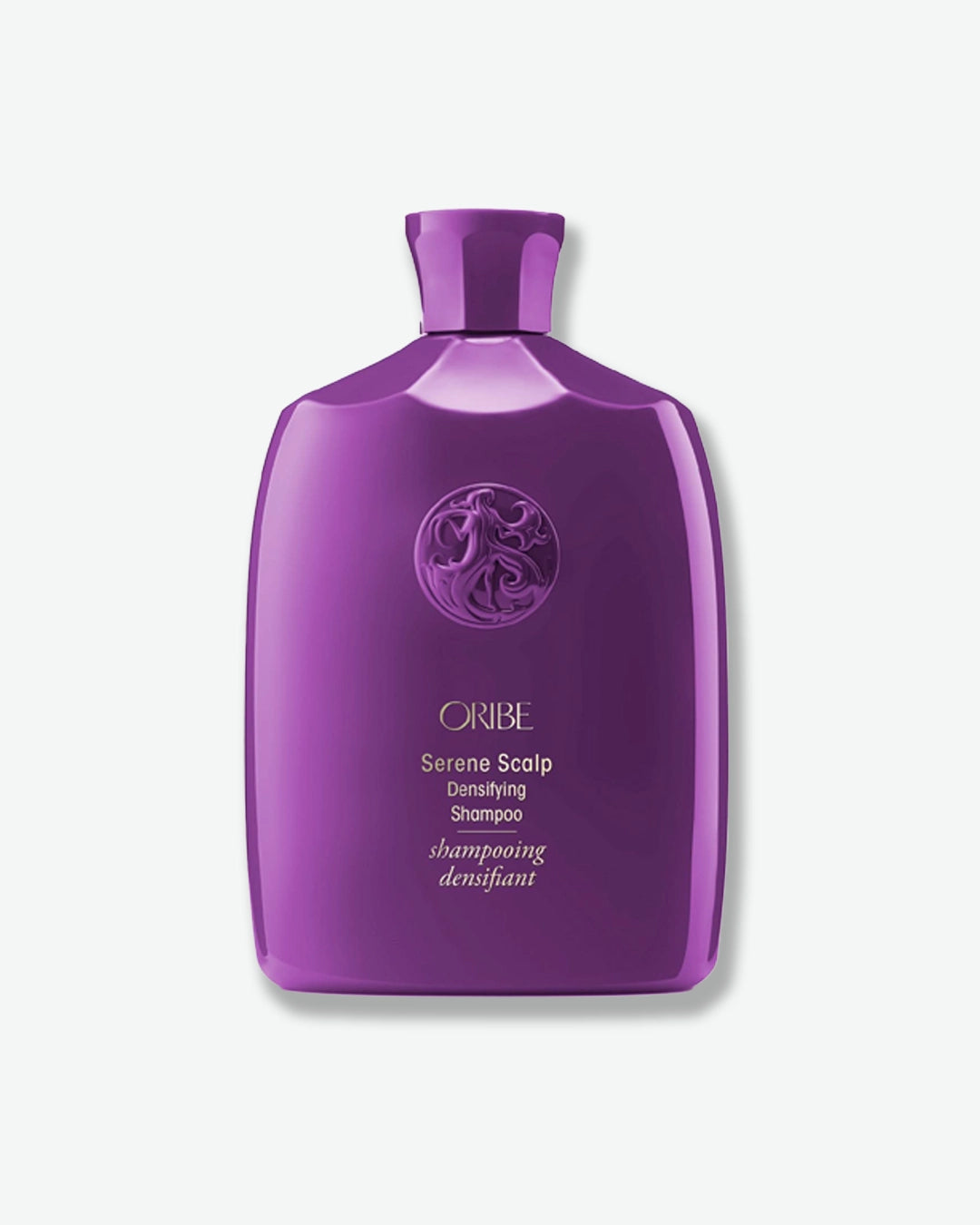 Purple Oribe shampoo bottle on a white background