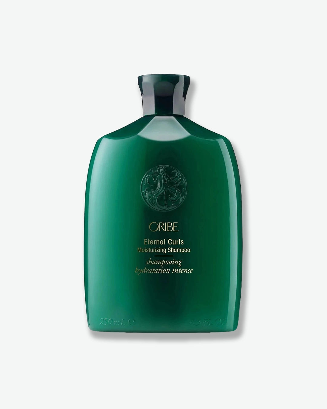 Green Oribe shampoo bottle on a white background