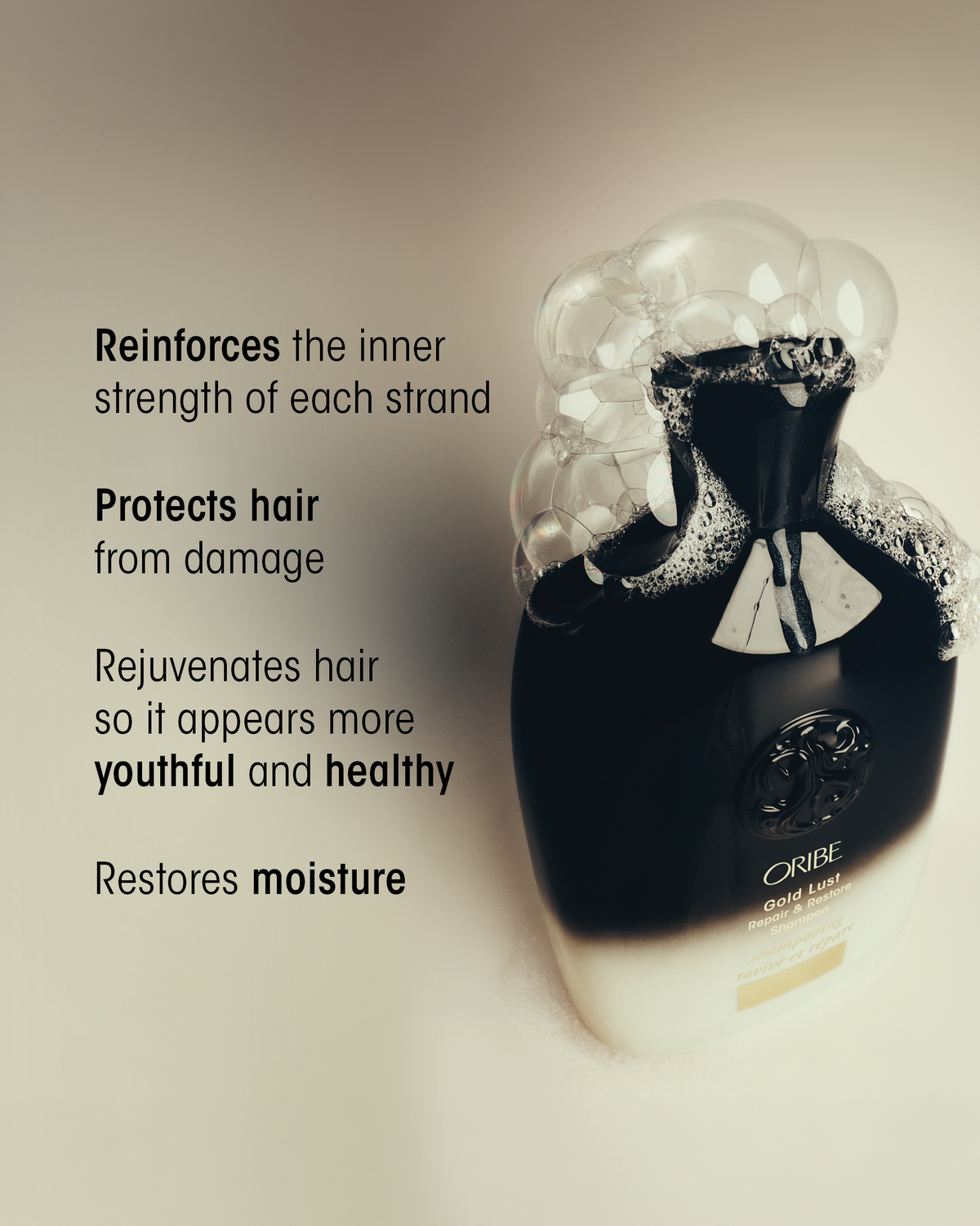 Oribe Gold Lust Repair & Restore Shampoo surrounded by lather with messaging highlighting stronger, protected, healthier-looking, moisturized hair.