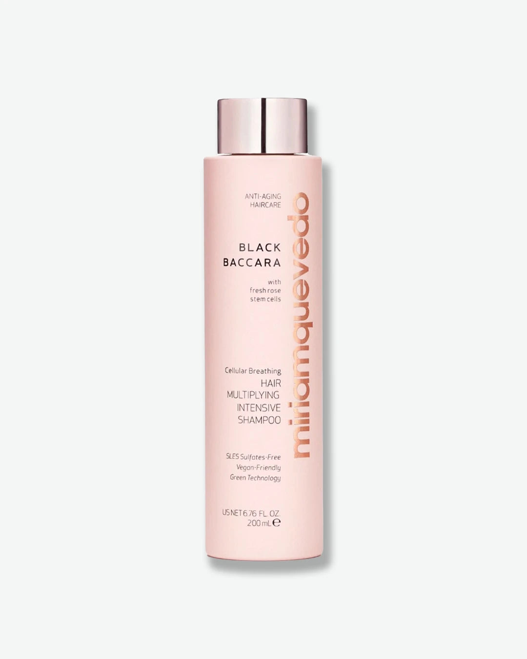 Pink shampoo bottle with silver cap on a white background