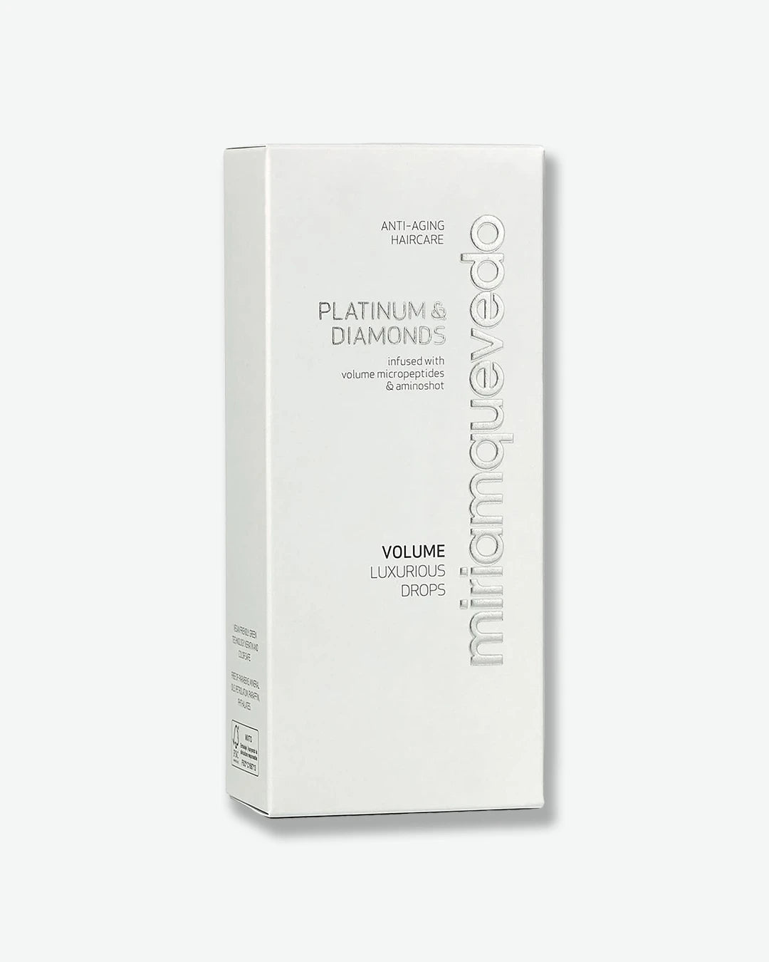 White hair care product box with 'miriam quevedo' branding on a white background