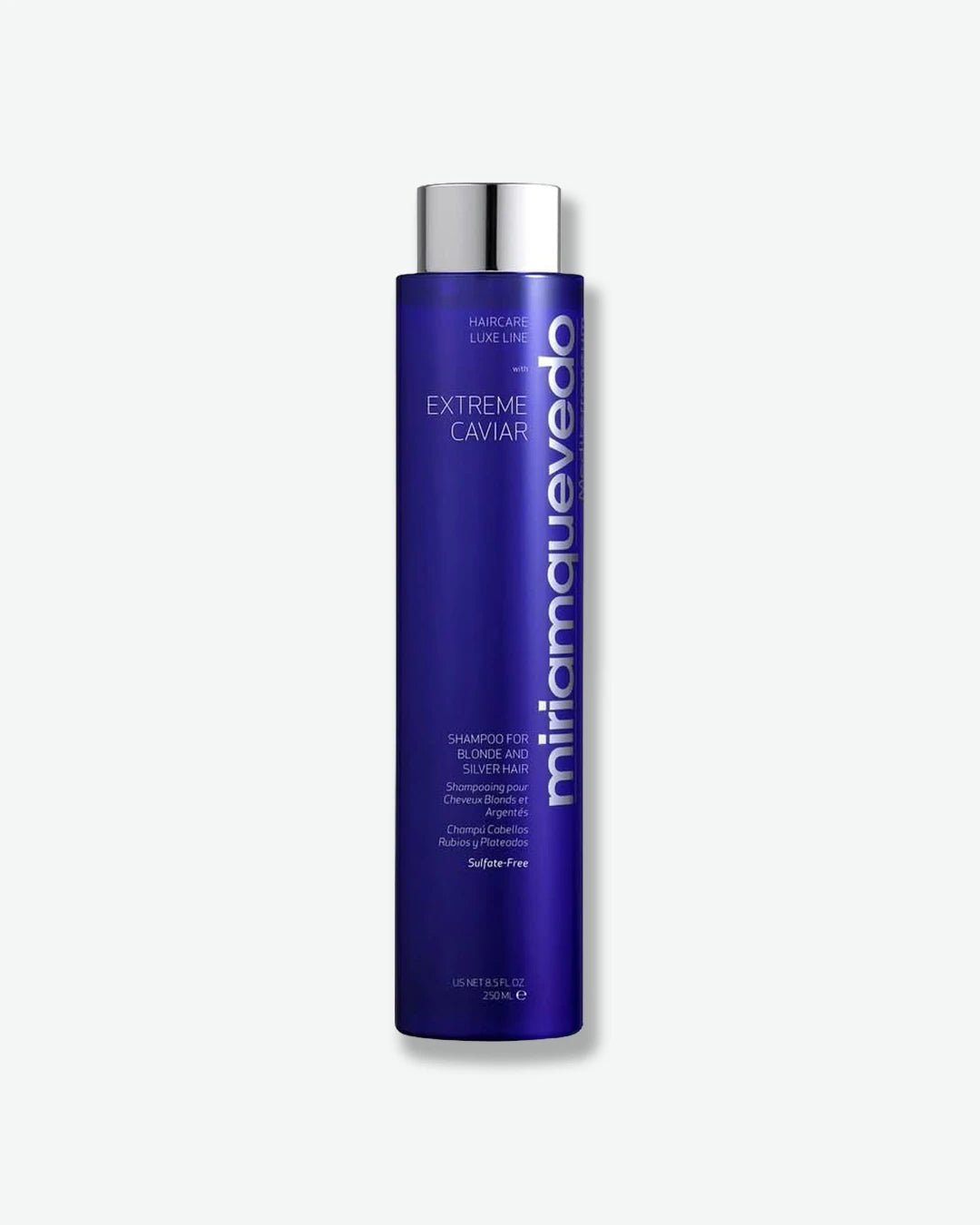 Blue shampoo bottle with silver cap on a white background