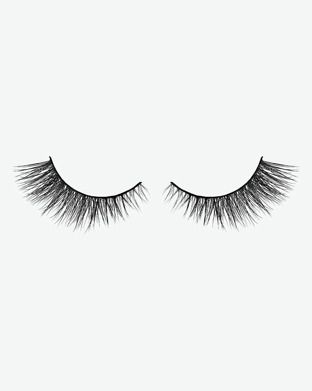 Pair of false eyelashes on a white background