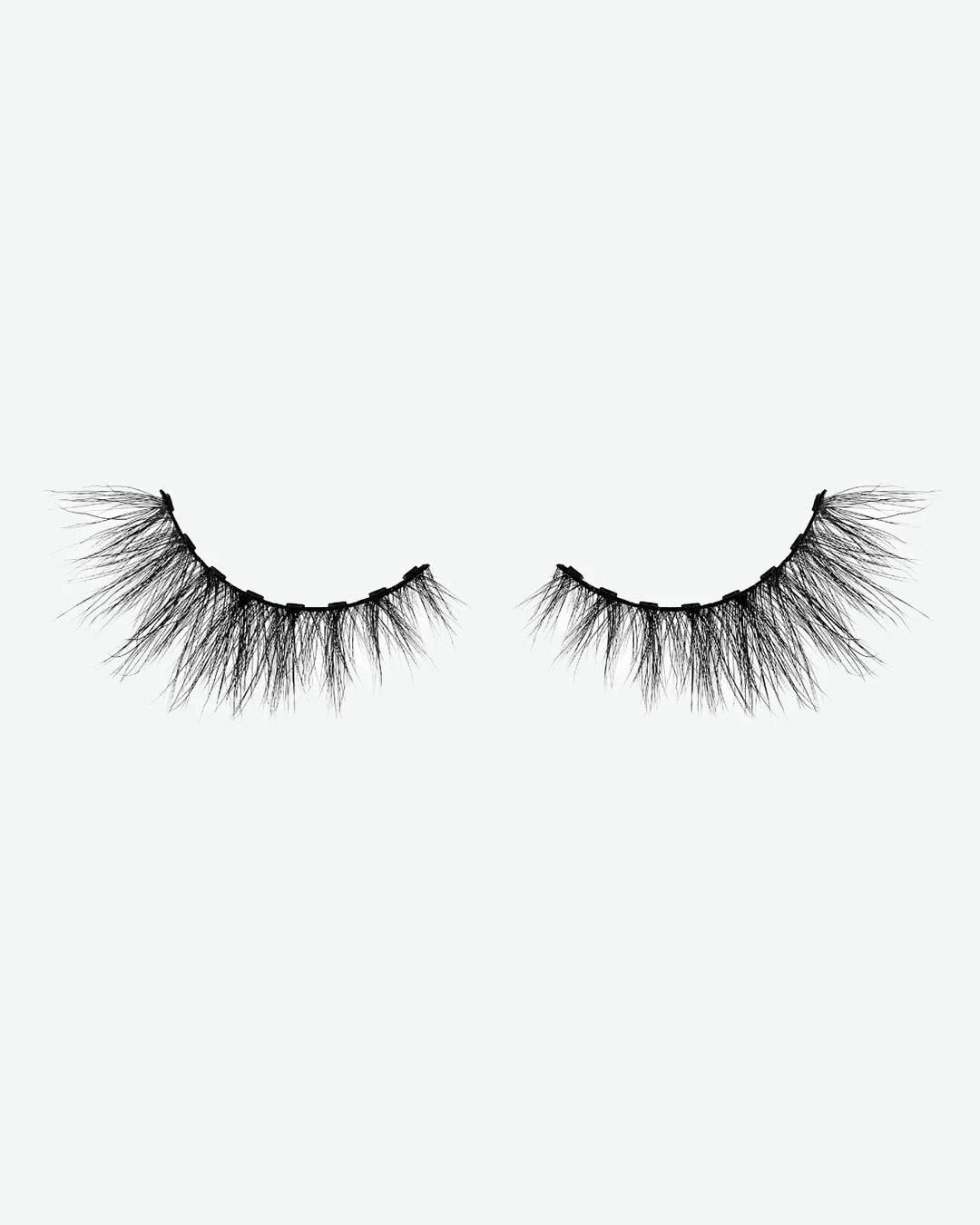 Pair of false eyelashes on a white background