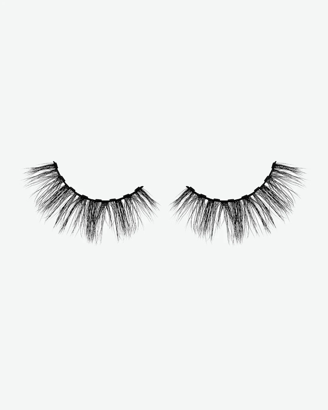 Pair of false eyelashes on a white background