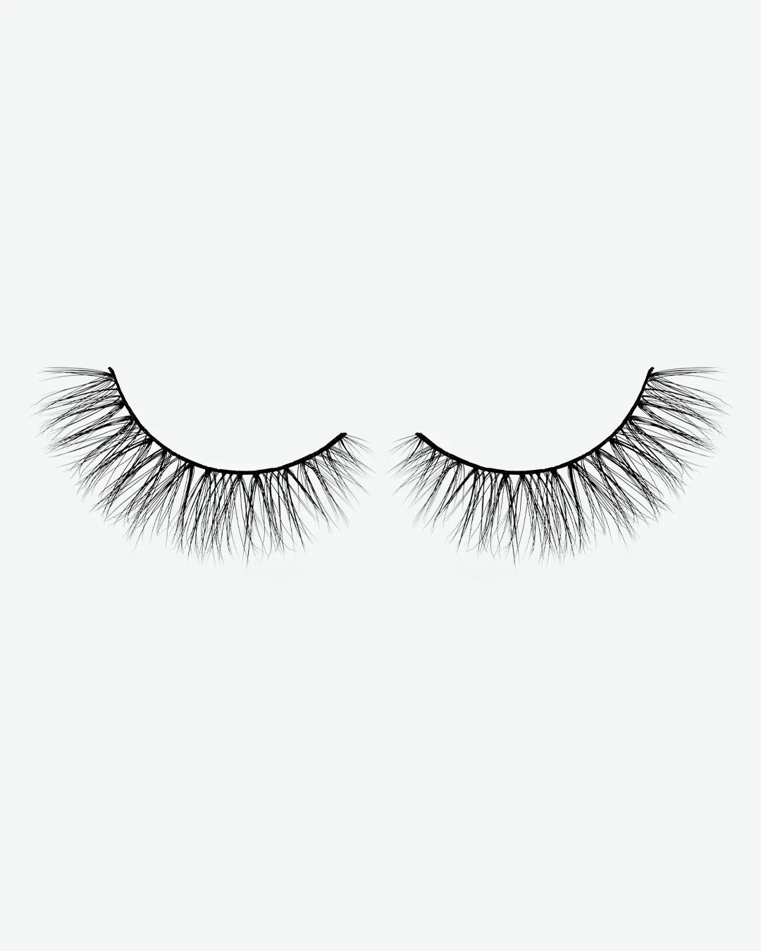 Pair of false eyelashes on a white background