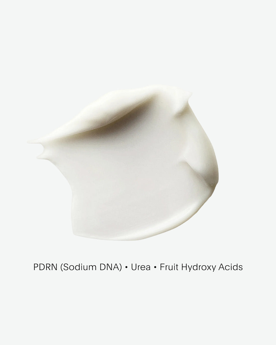 White cream or lotion swatch on a light gray background with text overlay.