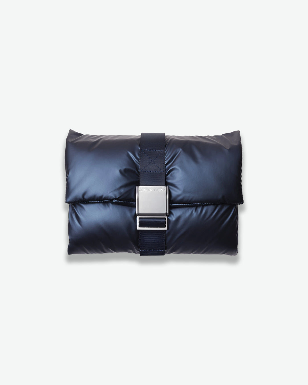 Navy blue puffer bag with a silver buckle on a light gray background