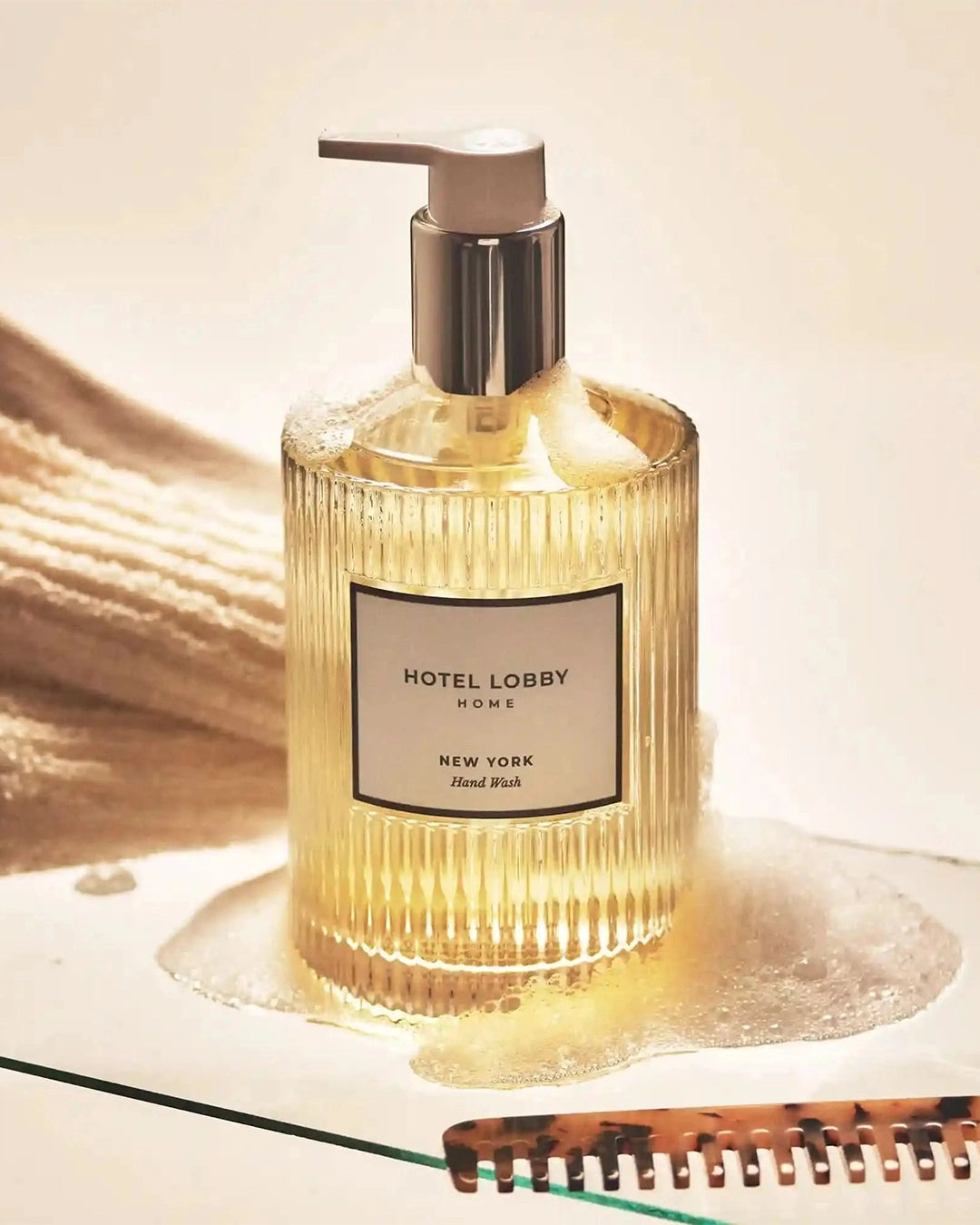 Hand wash bottle with pump from Hotel Lobby Home on a light background